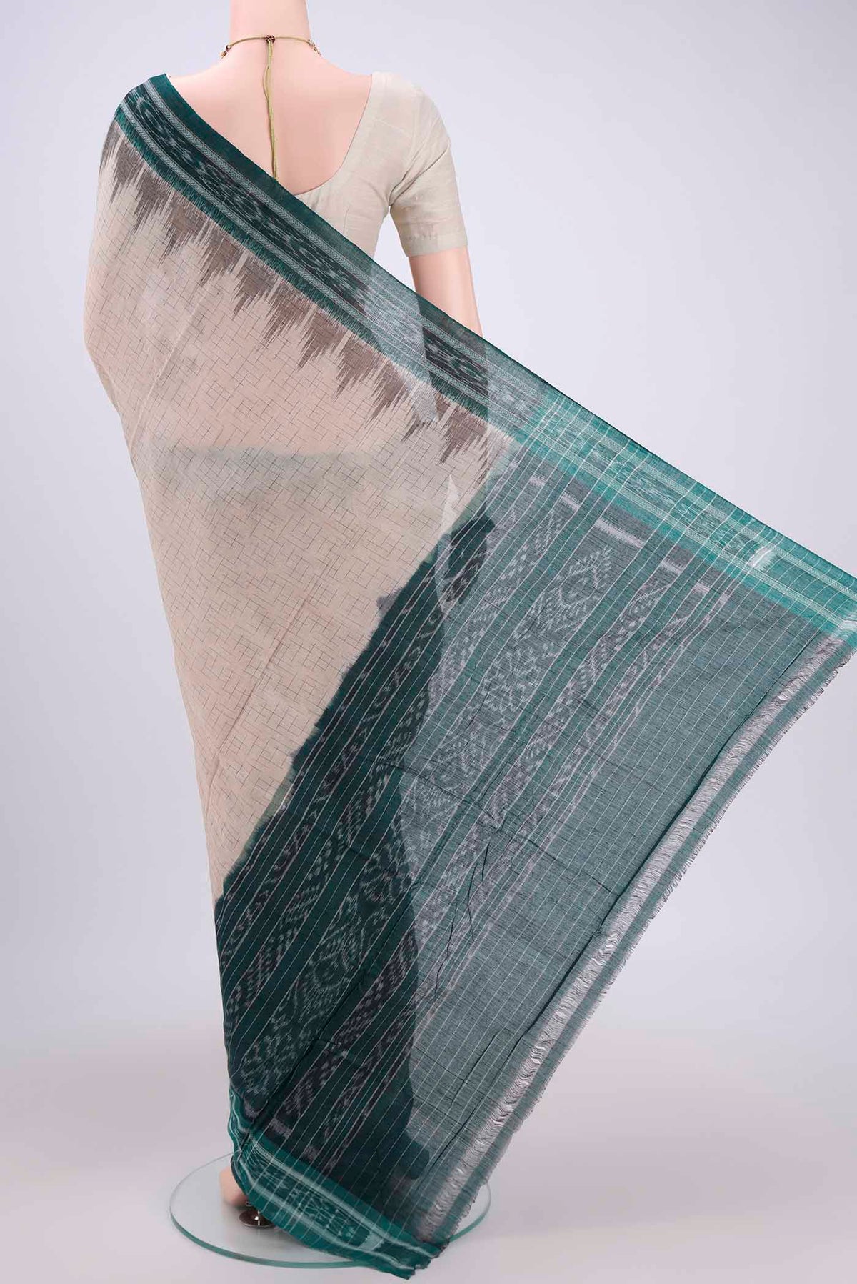 Flat view of Beige Pochampally Cotton Saree with Ikat design on the body and Ikat Border. 
