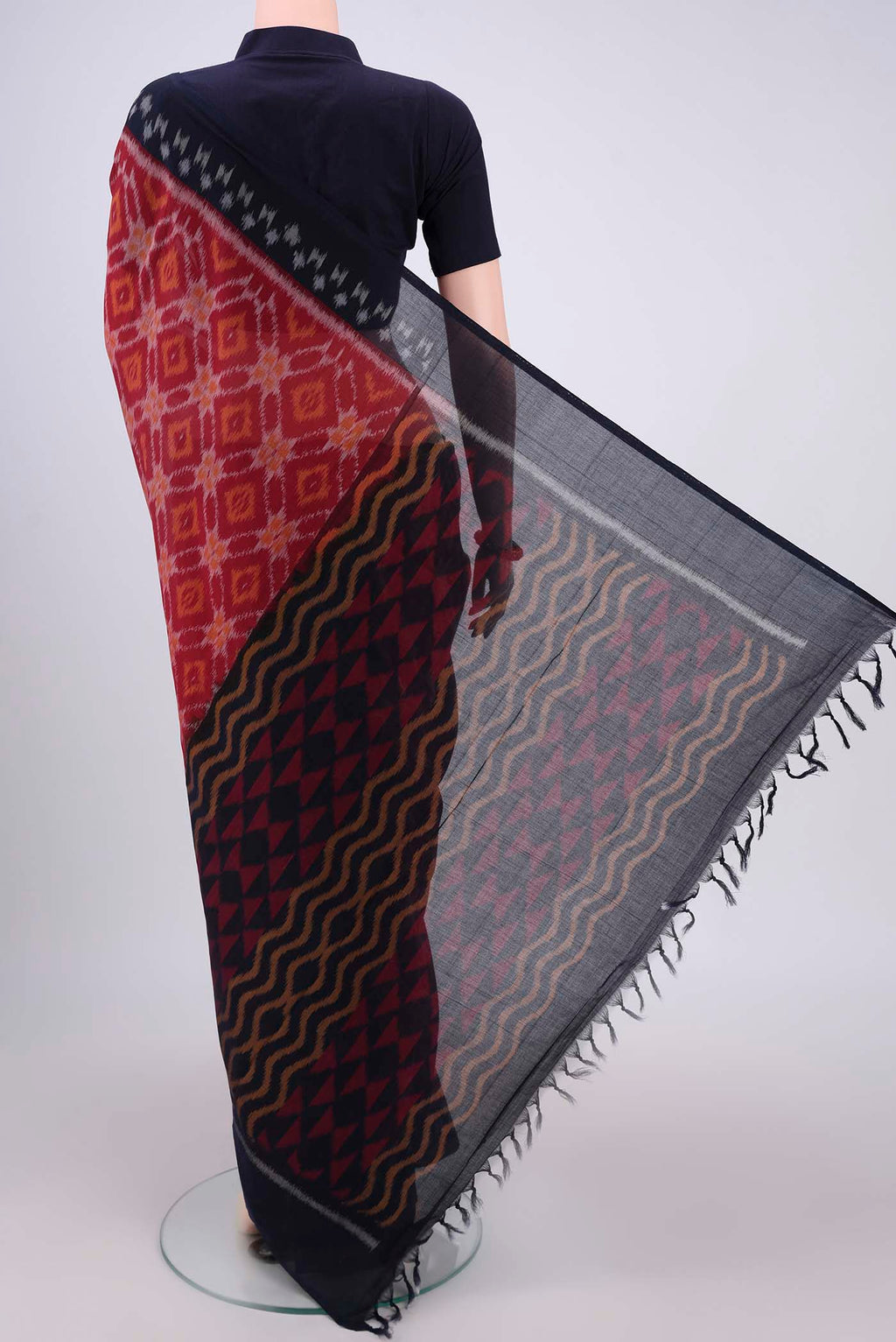 Flat view of Maroon Pochampally Cotton Saree with Ikat design on the body and Ikat Border. 