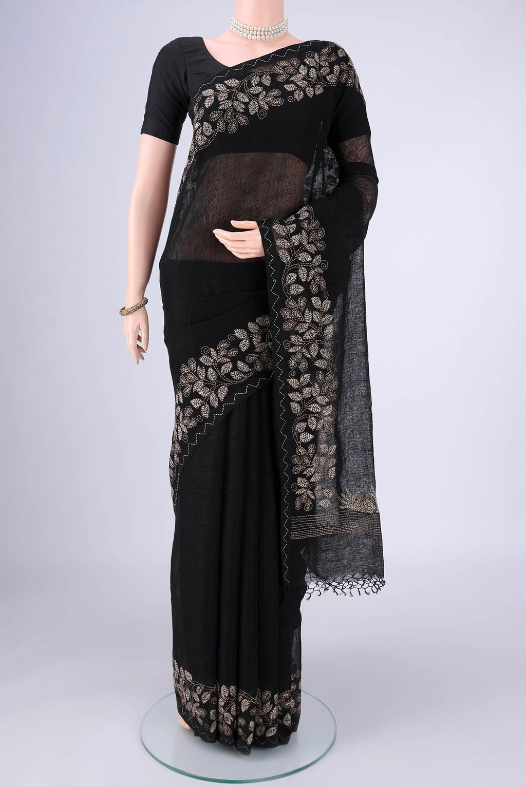 Black Linen Cotton Saree with Kantha Work on the body and Thread Border.  displayed on a mannequin