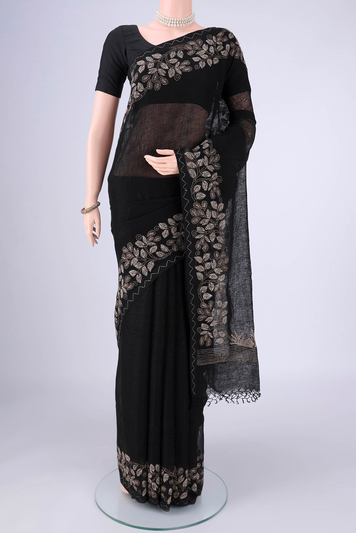 Black Linen Cotton Saree with Kantha Work on the body and Thread Border.  displayed on a mannequin