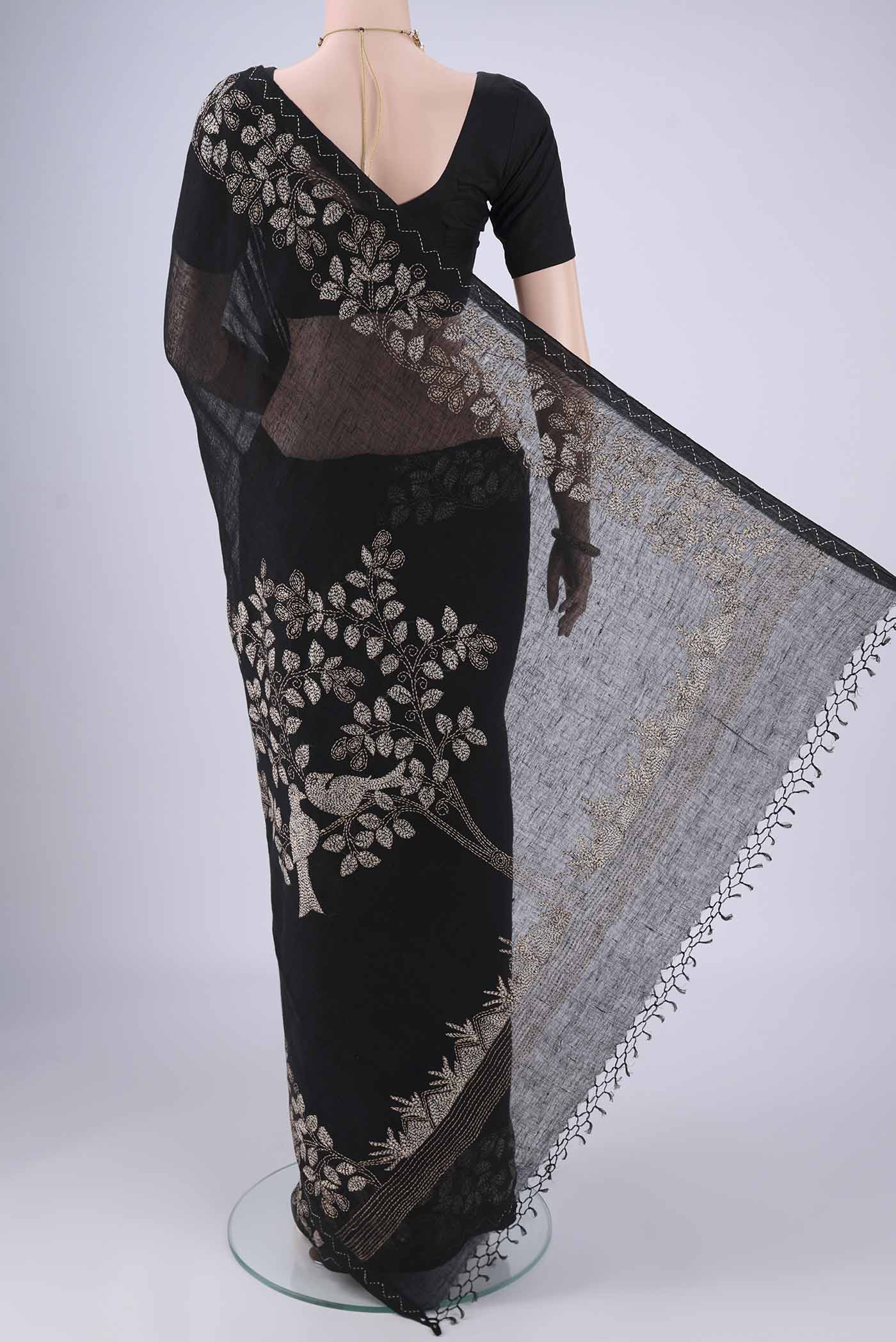 Flat view of Black Linen Cotton Saree with Kantha Work on the body and Thread Border. 