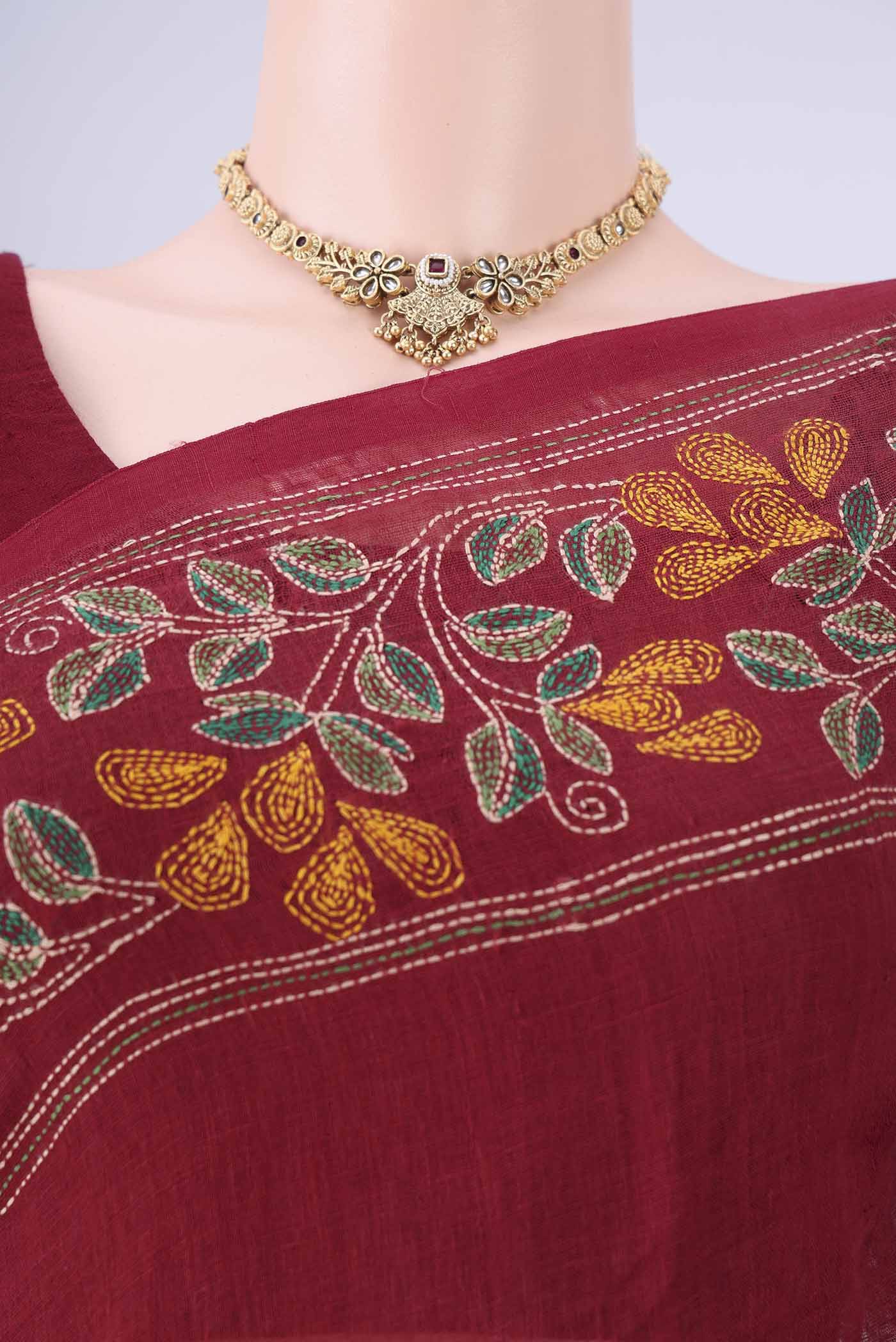Border image of Maroon Linen Cotton Saree with Kantha Work on the body and Thread Border. 