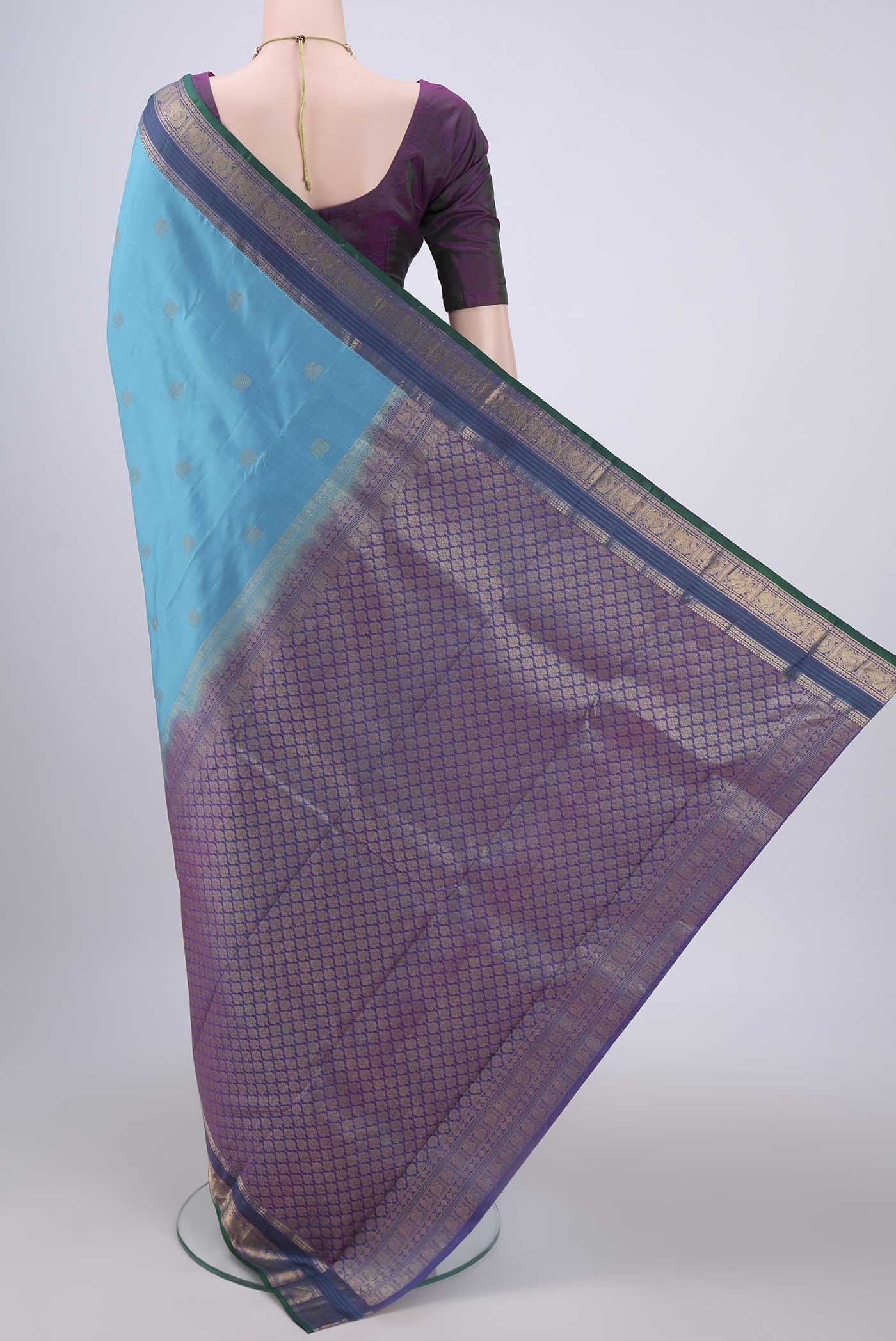 Flat view of Blue Kanchipuram Silk Saree with Zari Butta on the body and Zari Border. 