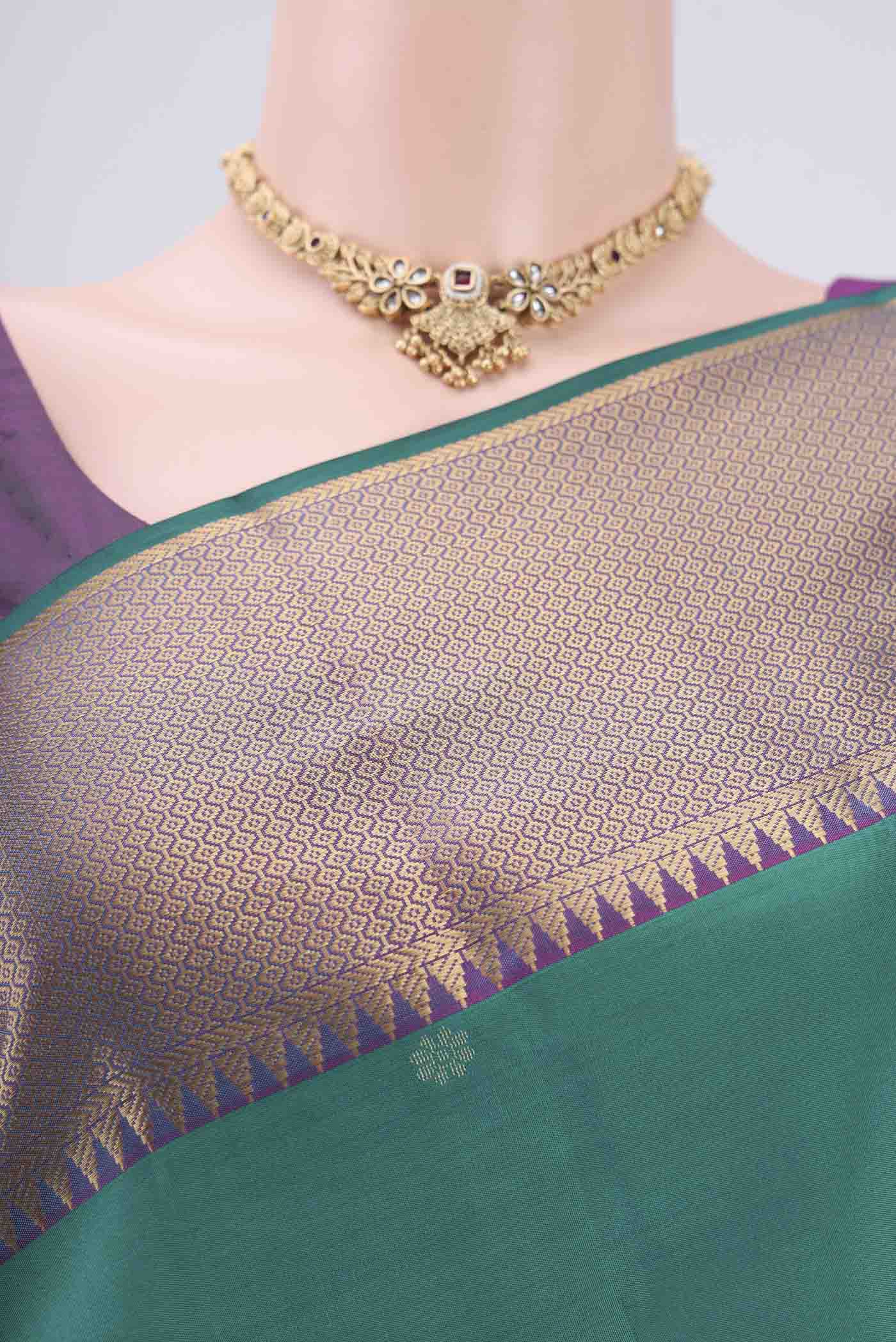 Border image of Green Kanchipuram Silk Saree with Zari Butta on the body and Zari Border. 