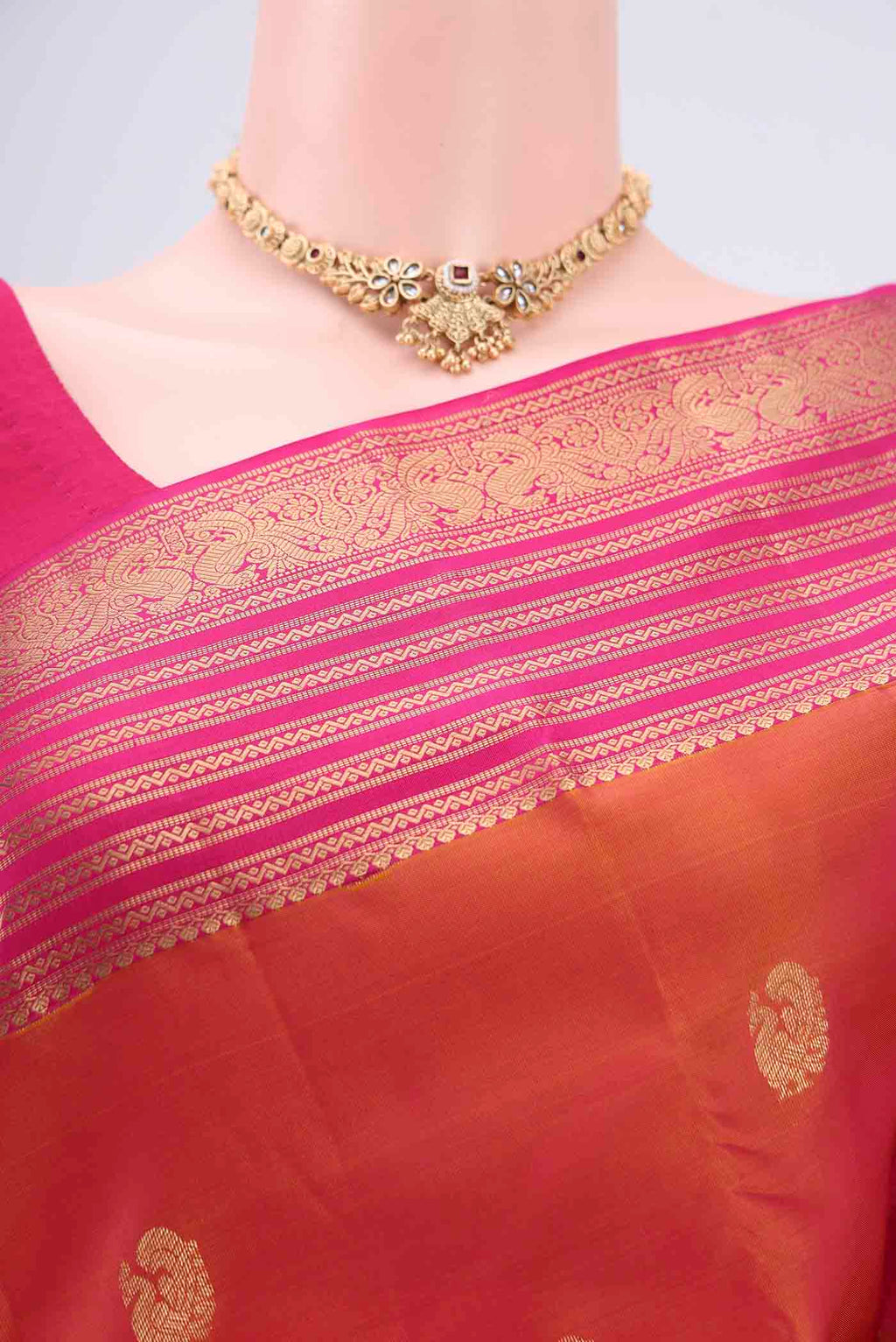 Border image of Brick Orange Kanchipuram Silk Saree with Zari Butta on the body and Zari Border. 