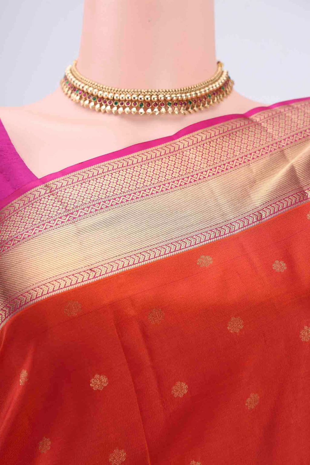 Border image of Orange Kanchipuram Silk Saree with Zari Butta on the body and Zari Border. 