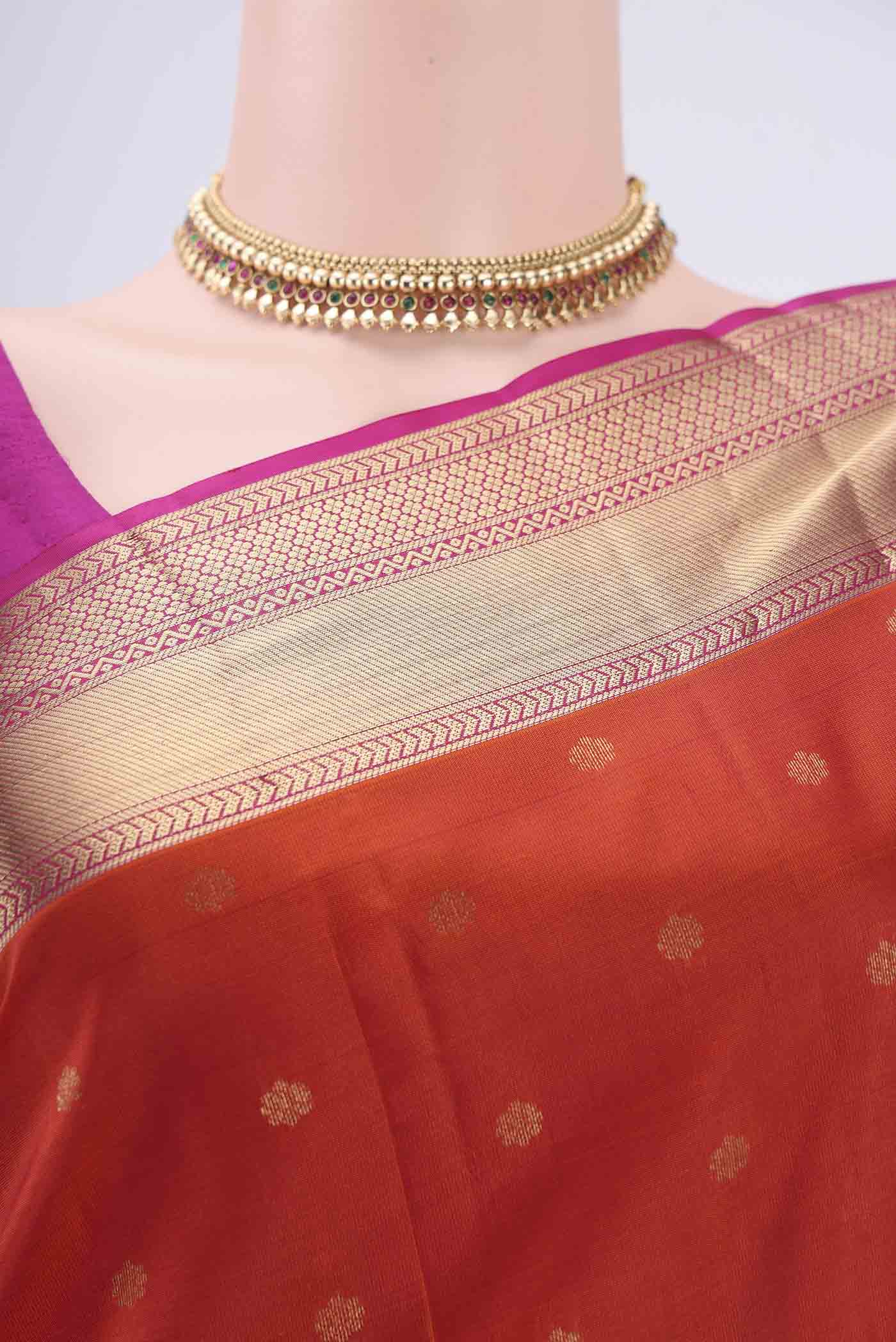 Border image of Orange Kanchipuram Silk Saree with Zari Butta on the body and Zari Border. 