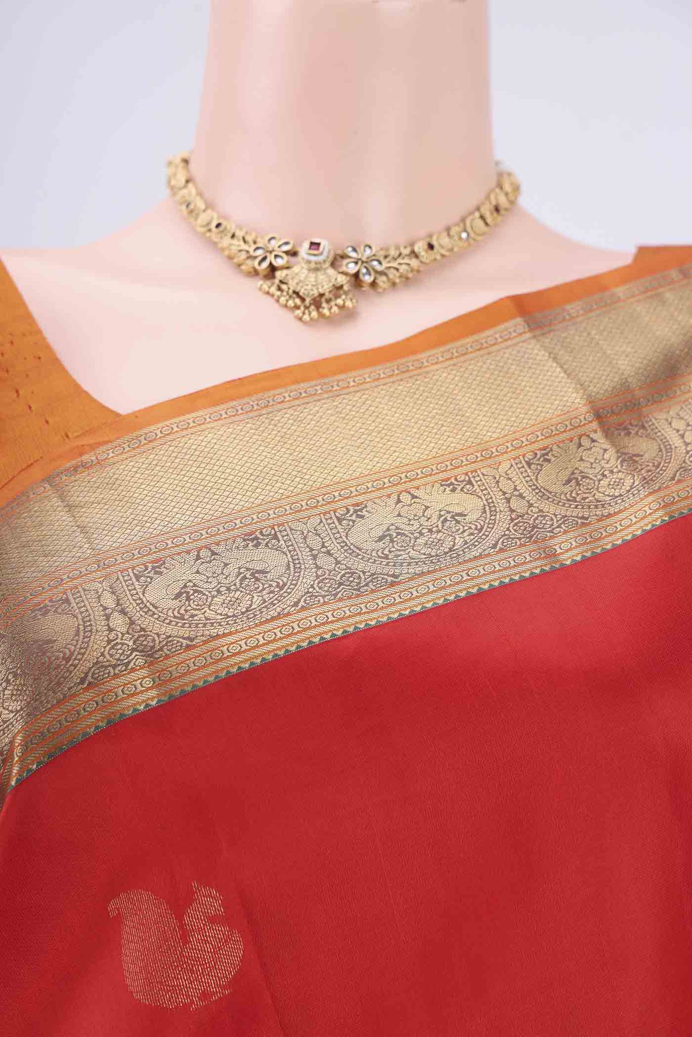 Border image of Red Kanchipuram Silk Saree with Zari Butta on the body and Zari Border. 