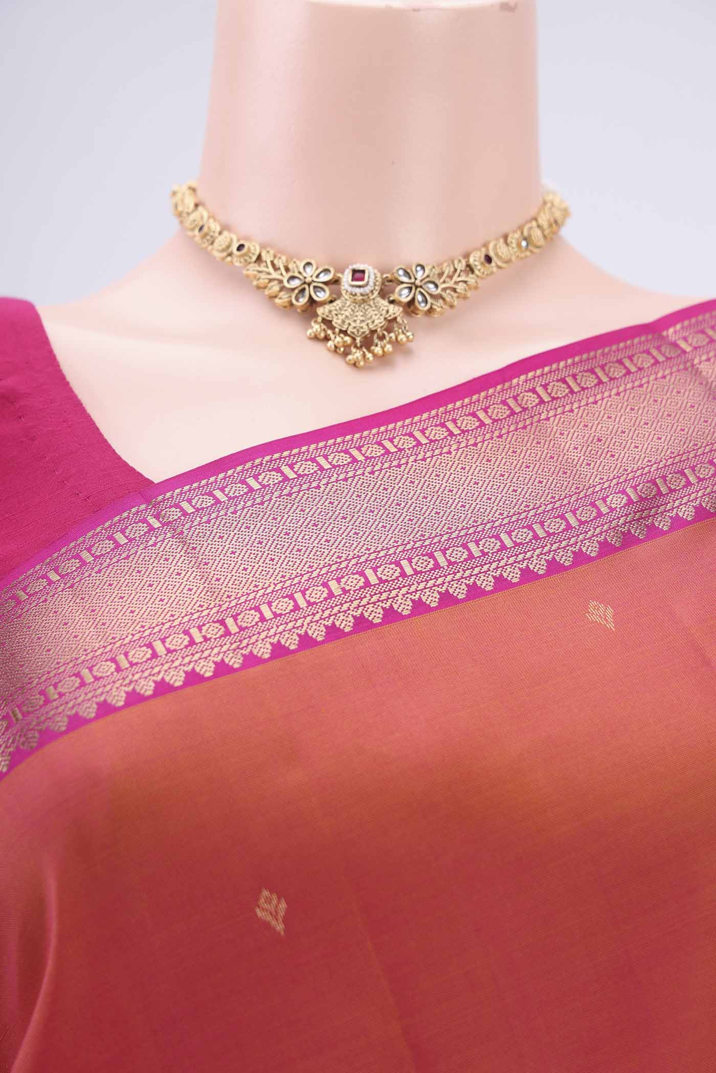 Border image of Pinkish Yellow Kanchipuram Silk Saree with Zari Butta on the body and Zari Border. 