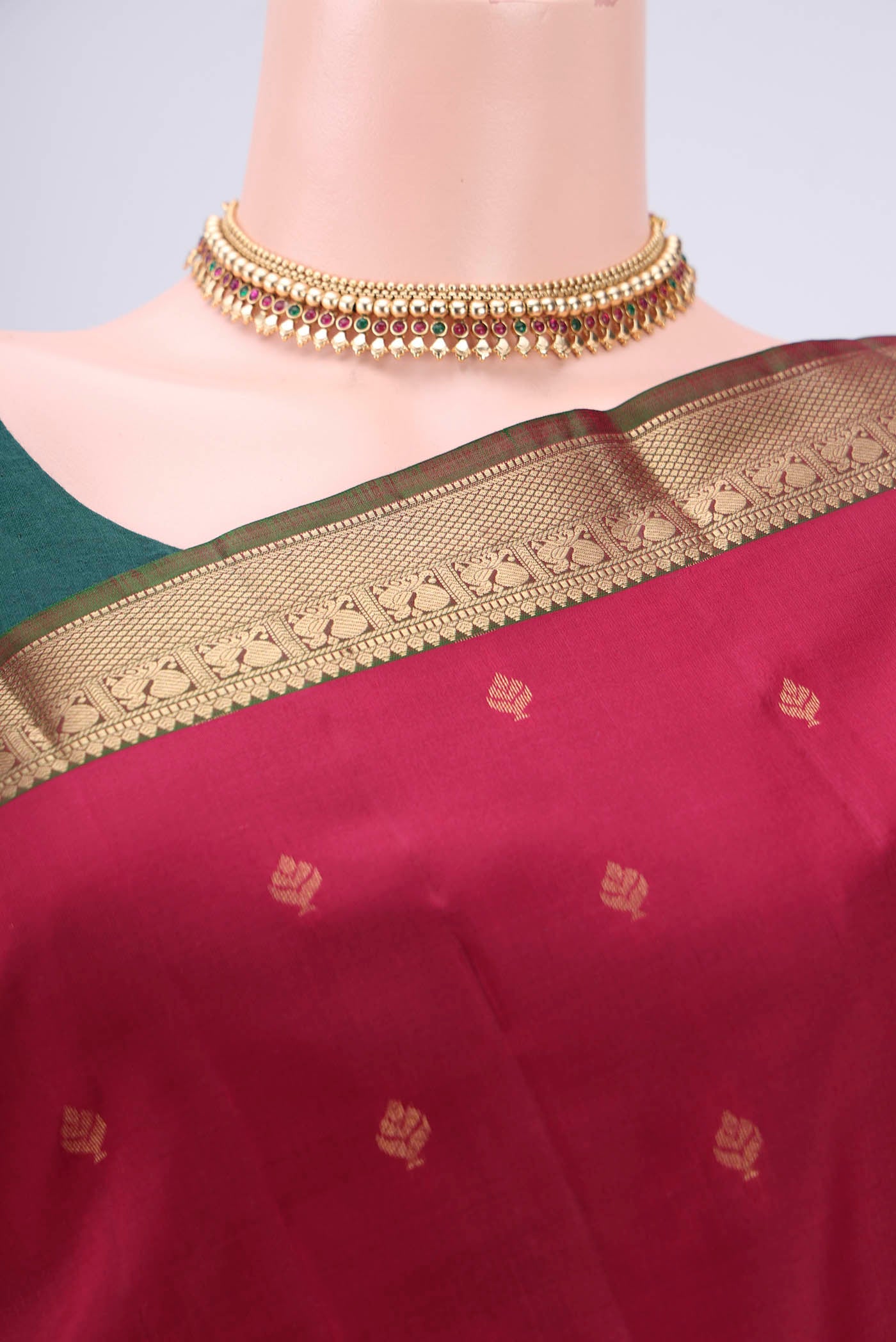 Border image of Maroon Kanchipuram Silk Saree with Zari Butta on the body and Zari Border. 