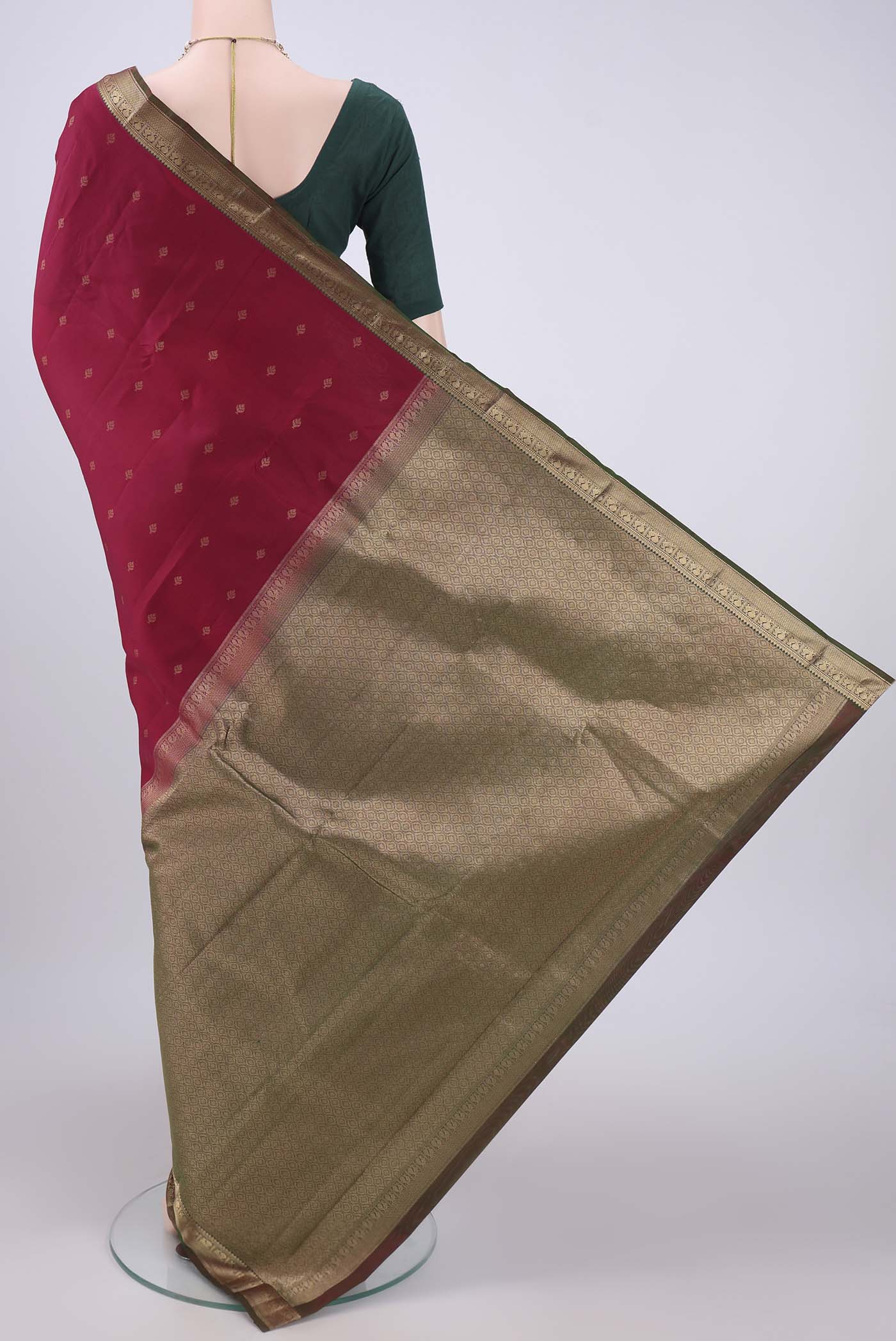 Flat view of Maroon Kanchipuram Silk Saree with Zari Butta on the body and Zari Border. 