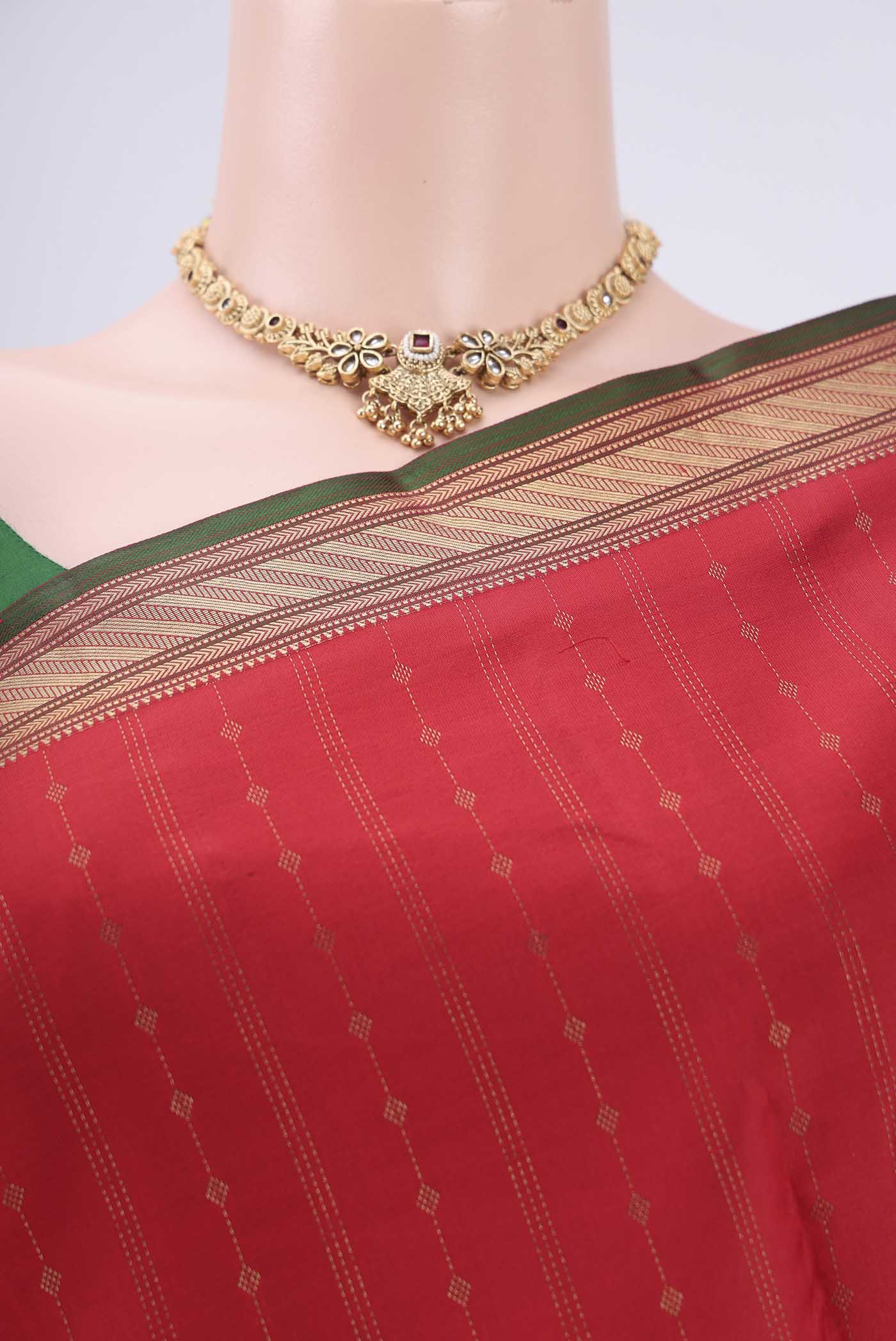 Border image of Imperial Red Kanchipuram Silk Saree with Zari Butta on the body and Zari Border. 