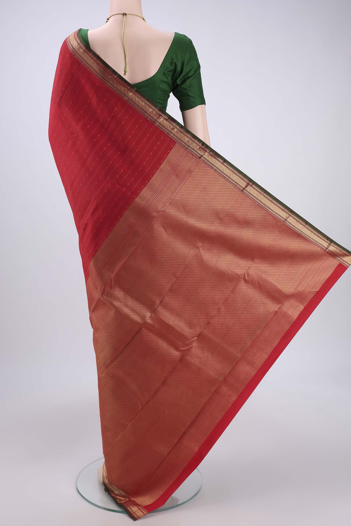 Flat view of Imperial Red Kanchipuram Silk Saree with Zari Butta on the body and Zari Border. 