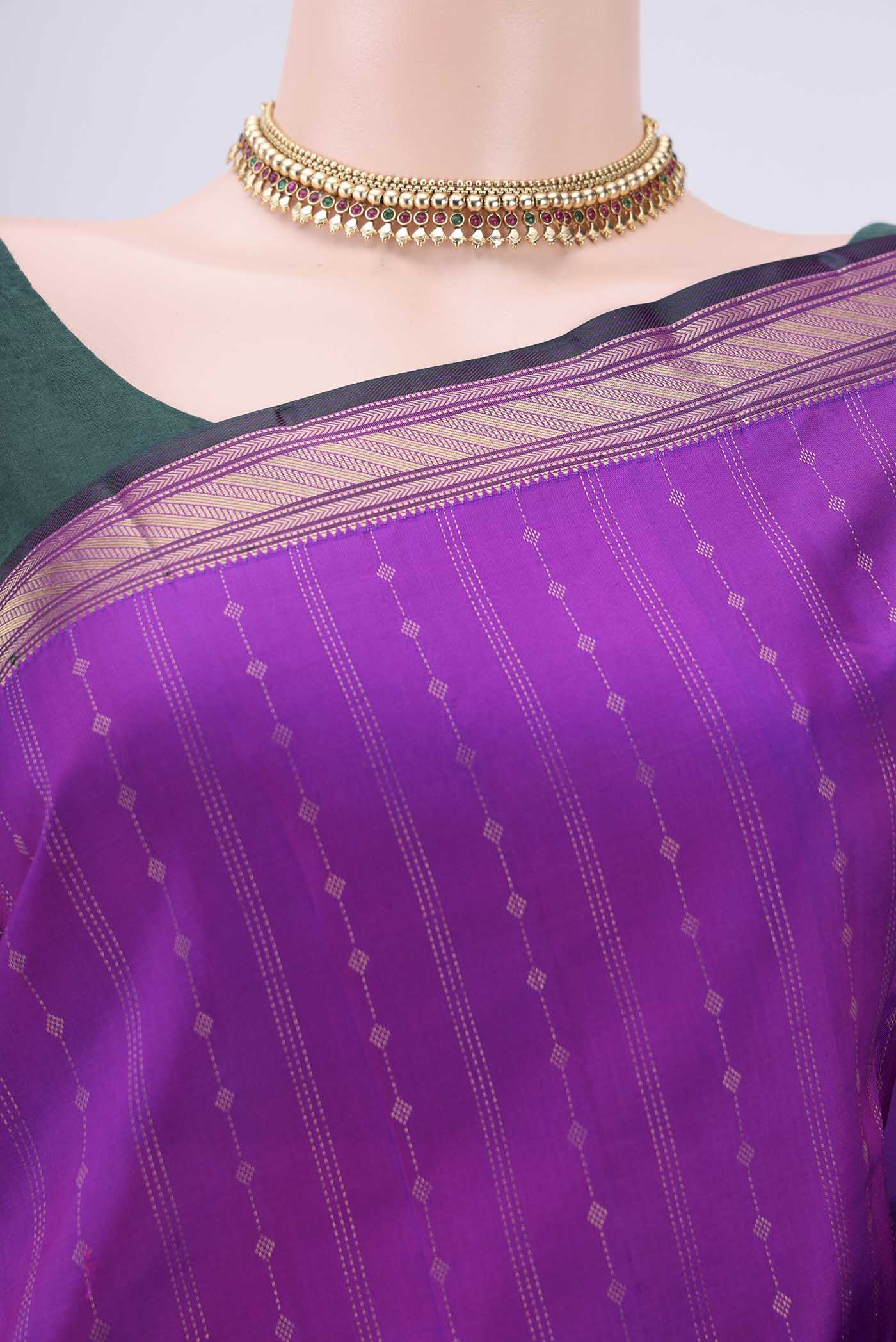 Border image of Magenta Kanchipuram Silk Saree with Zari Butta on the body and Zari Border. 