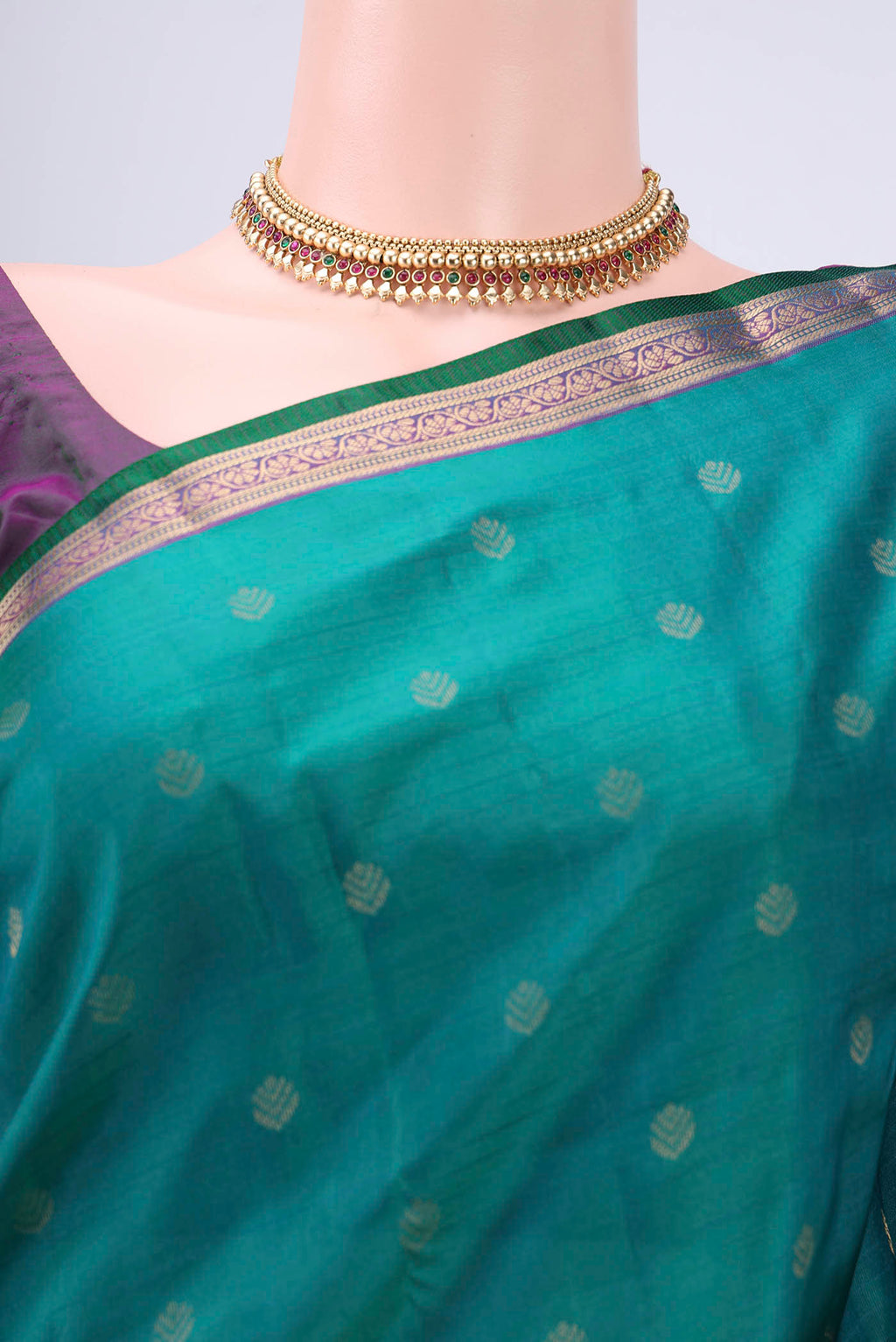 Border image of Green Kanchipuram Silk Saree with Zari Butta on the body and Zari Border. 