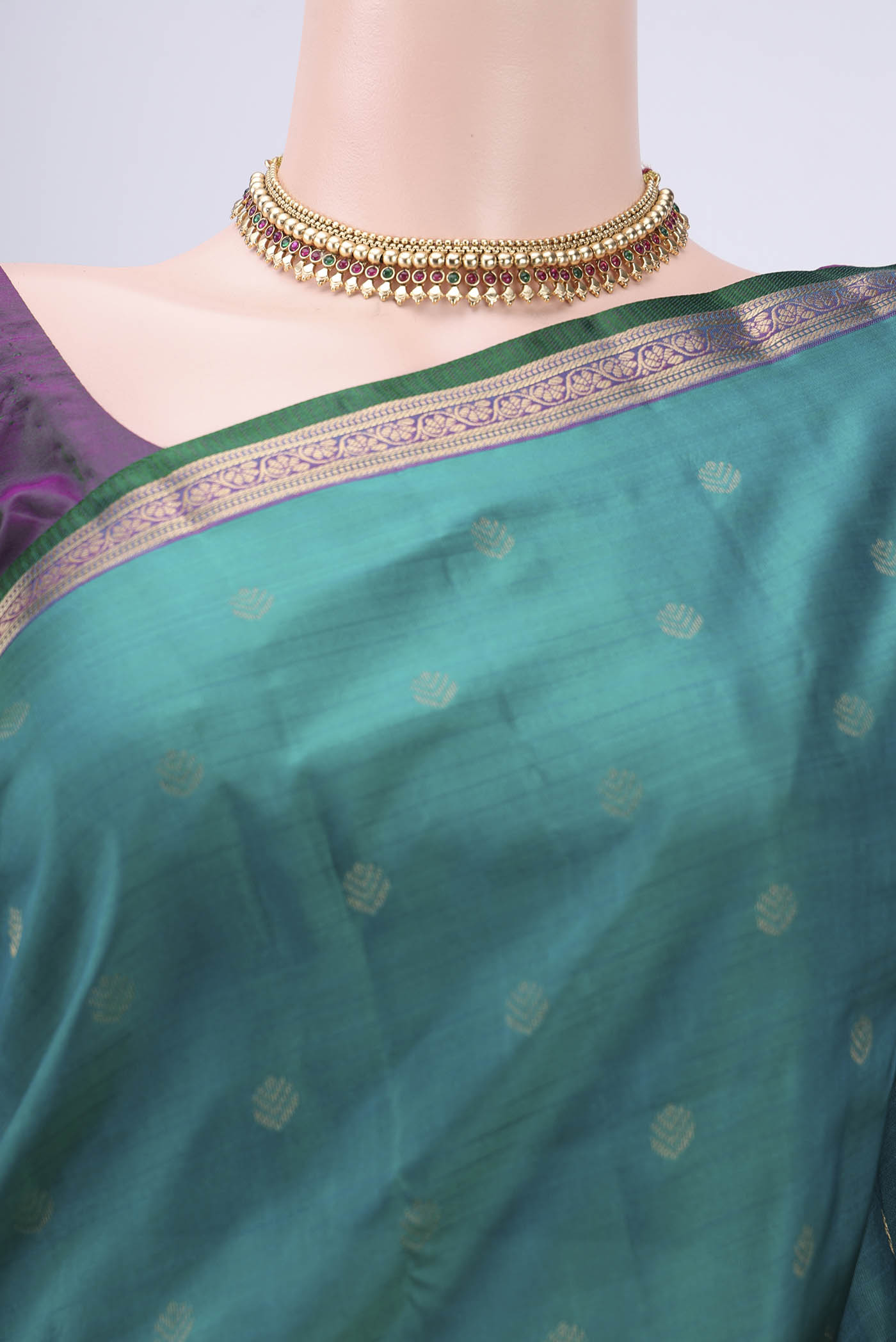 Border image of Green Kanchipuram Silk Saree with Zari Butta on the body and Zari Border. 
