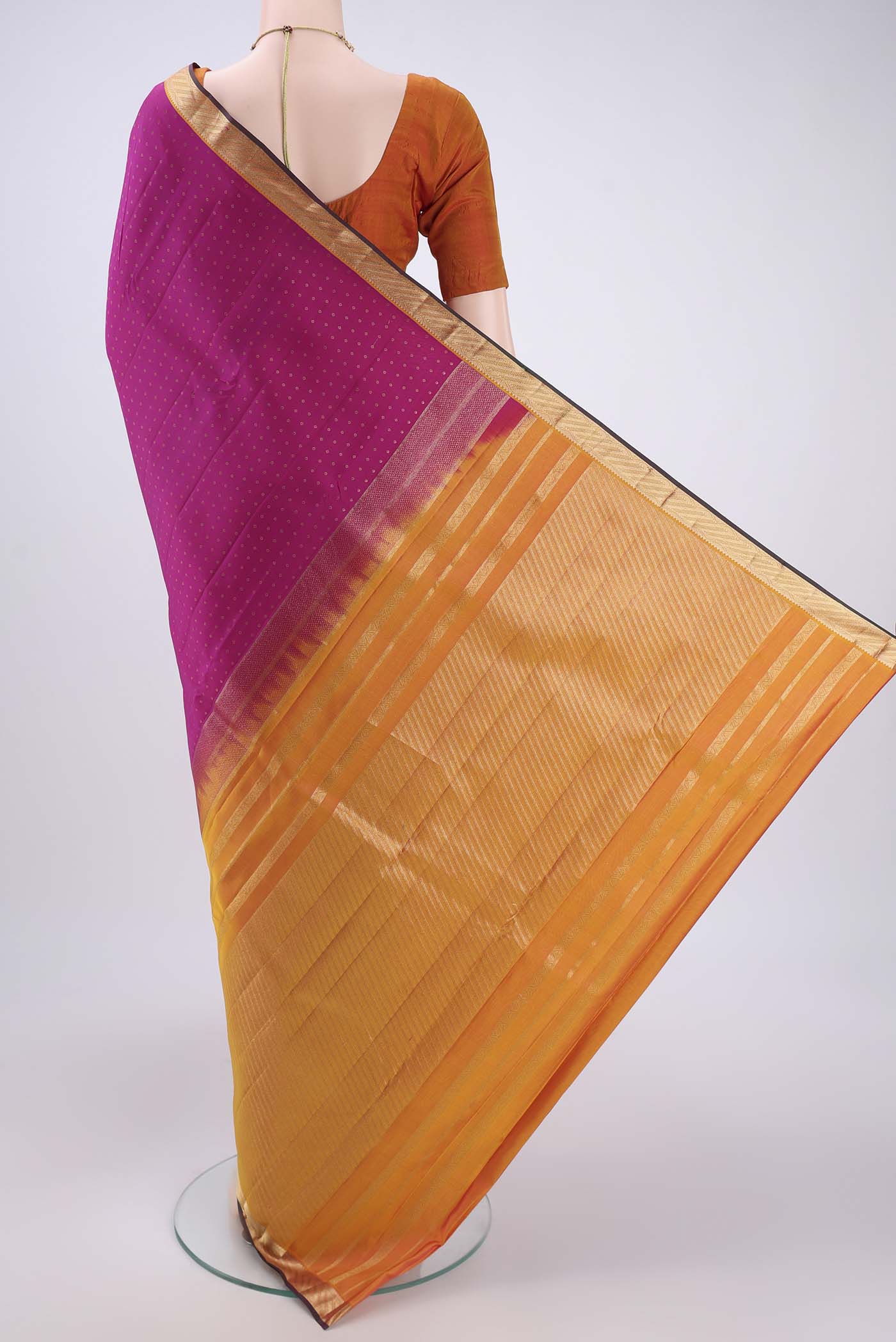 Flat view of Pink Kanchipuram Silk Saree with Zari Butta on the body and Zari Border. 