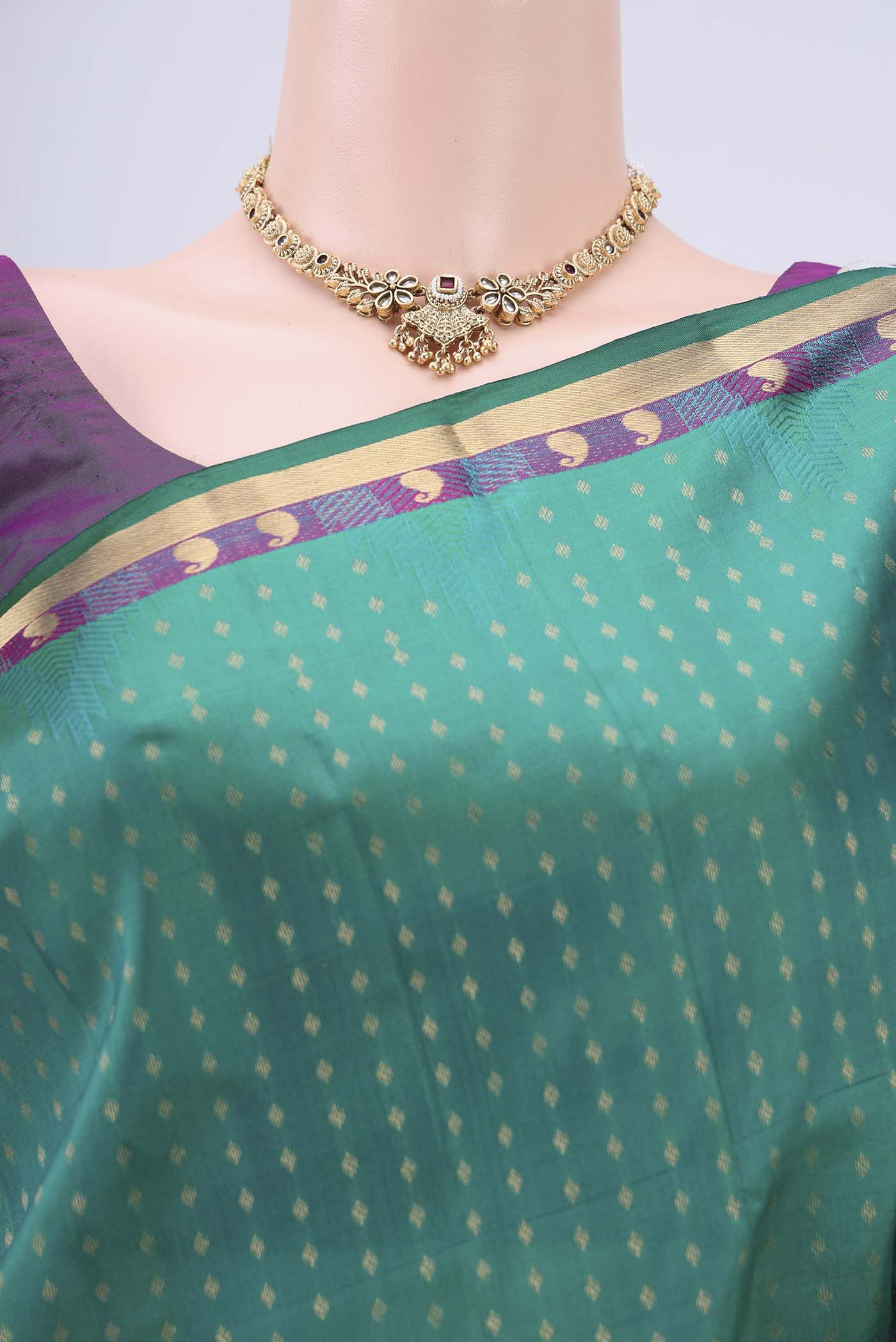 Border image of Green Kanchipuram Silk Saree with Zari Butta on the body and Zari Border. 
