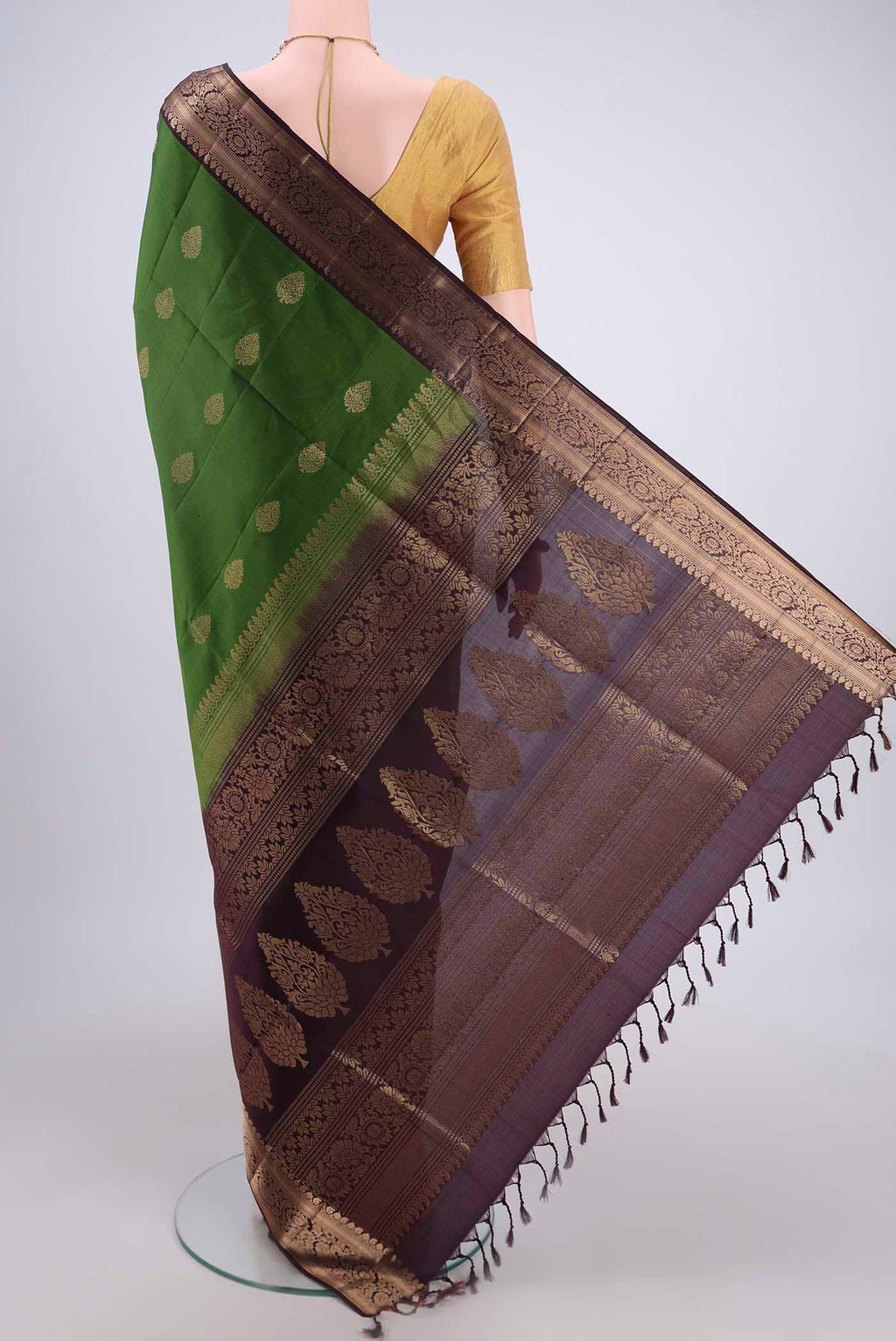 Flat view of Green Soft Silk Saree with Zari Butta on the body and Zari Border. 