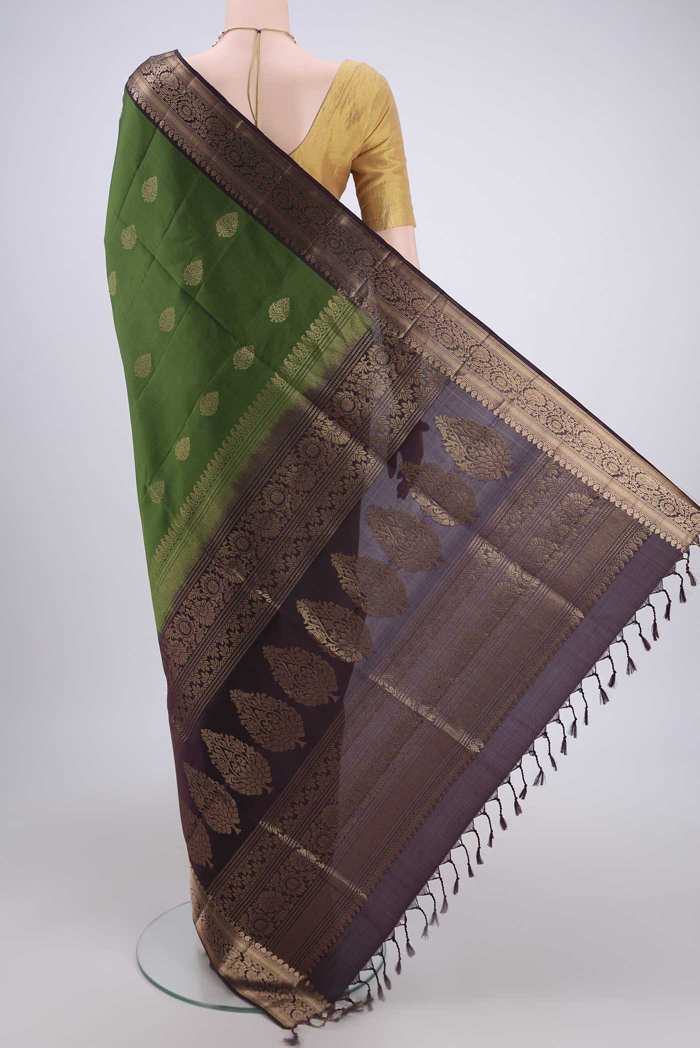 Flat view of Green Soft Silk Saree with Zari Butta on the body and Zari Border. 