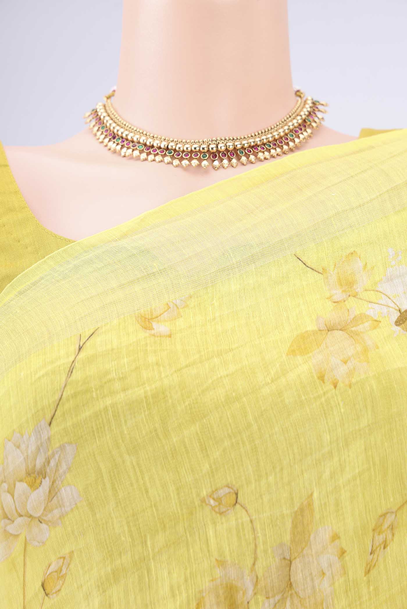 Border image of Lemon Yellow Linen Saree with Animal Print on the body and Zari Border. 