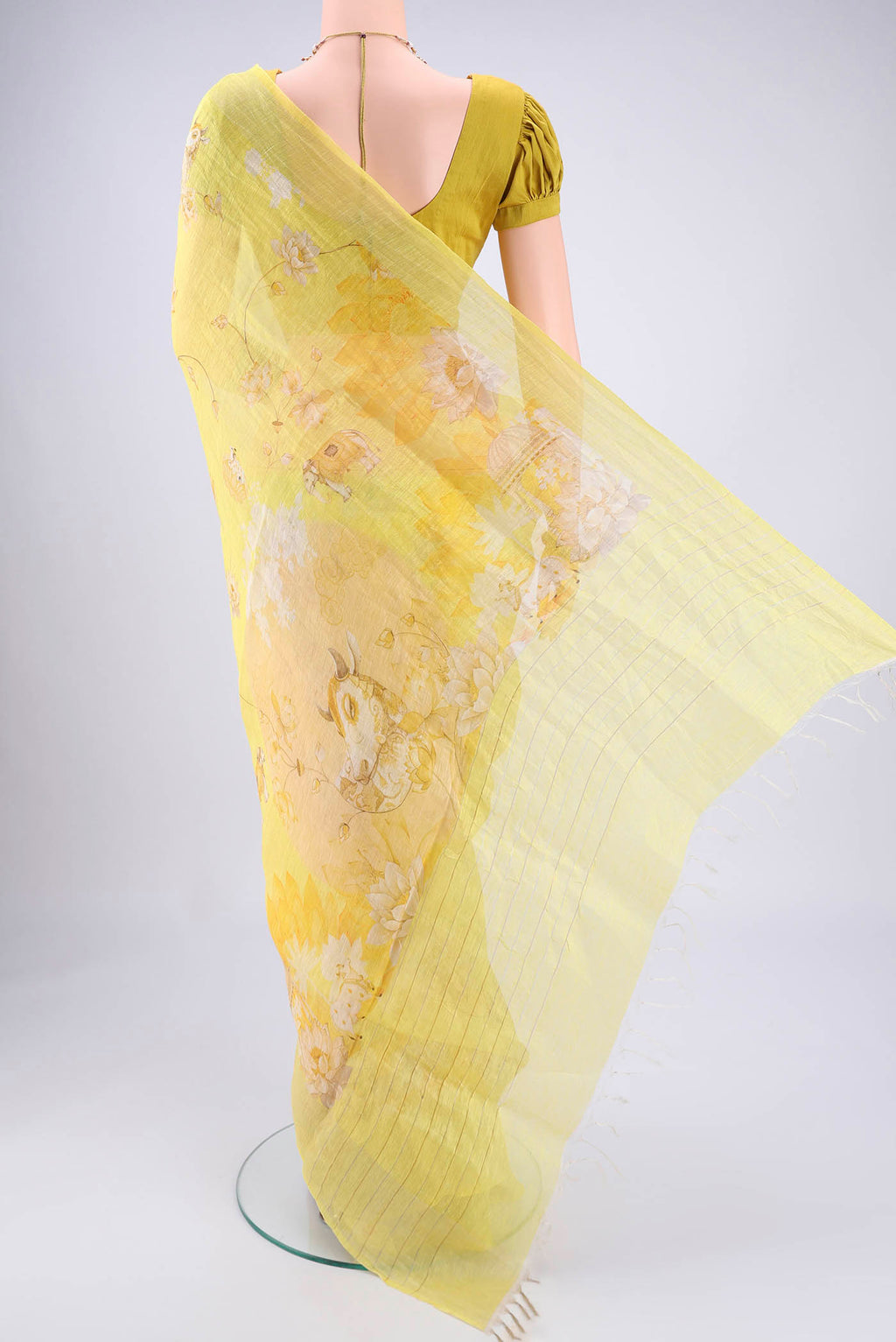 Flat view of Lemon Yellow Linen Saree with Animal Print on the body and Zari Border. 