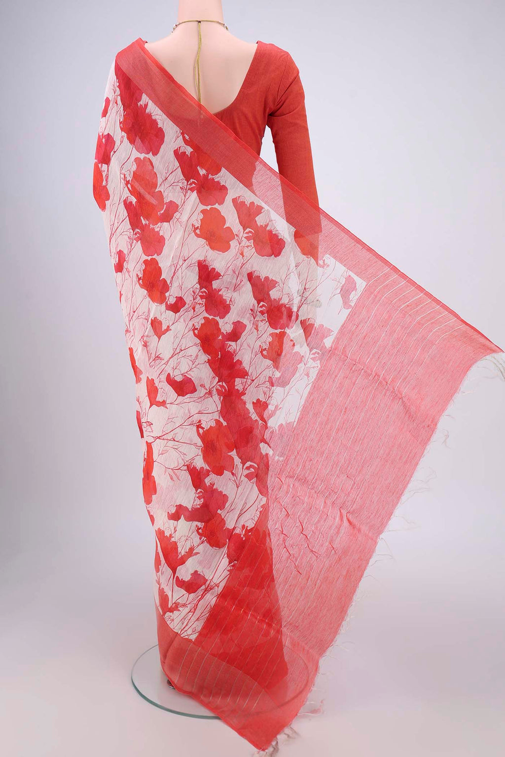 Flat view of Off White Linen Saree with Floral Print on the body and Zari Border. 