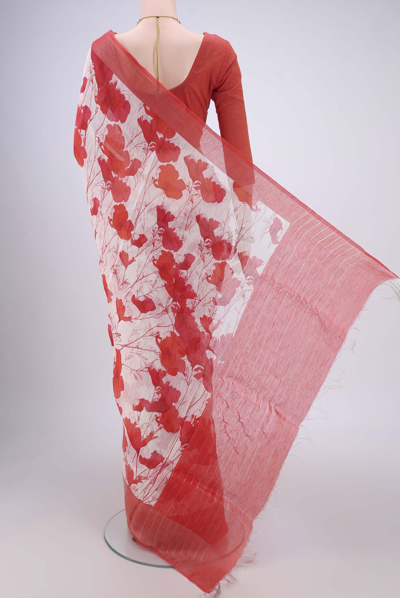 Flat view of Off White Linen Saree with Floral Print on the body and Zari Border. 