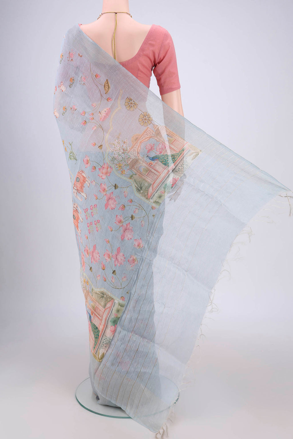 Flat view of Blue Grey Linen Saree with Floral Print on the body and Zari Border. 