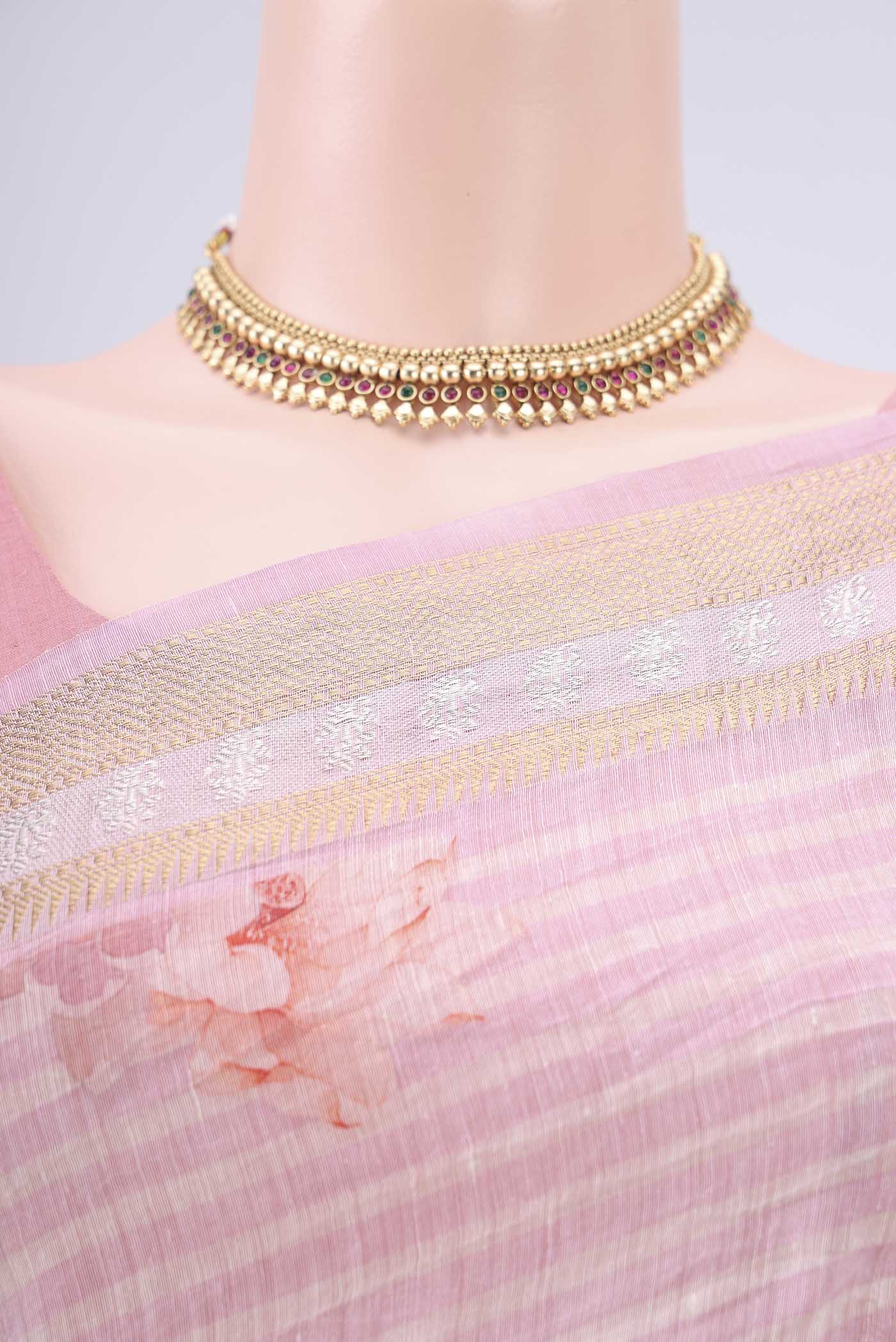 Border image of Off White Linen Saree with Floral Print on the body and Zari Border. 