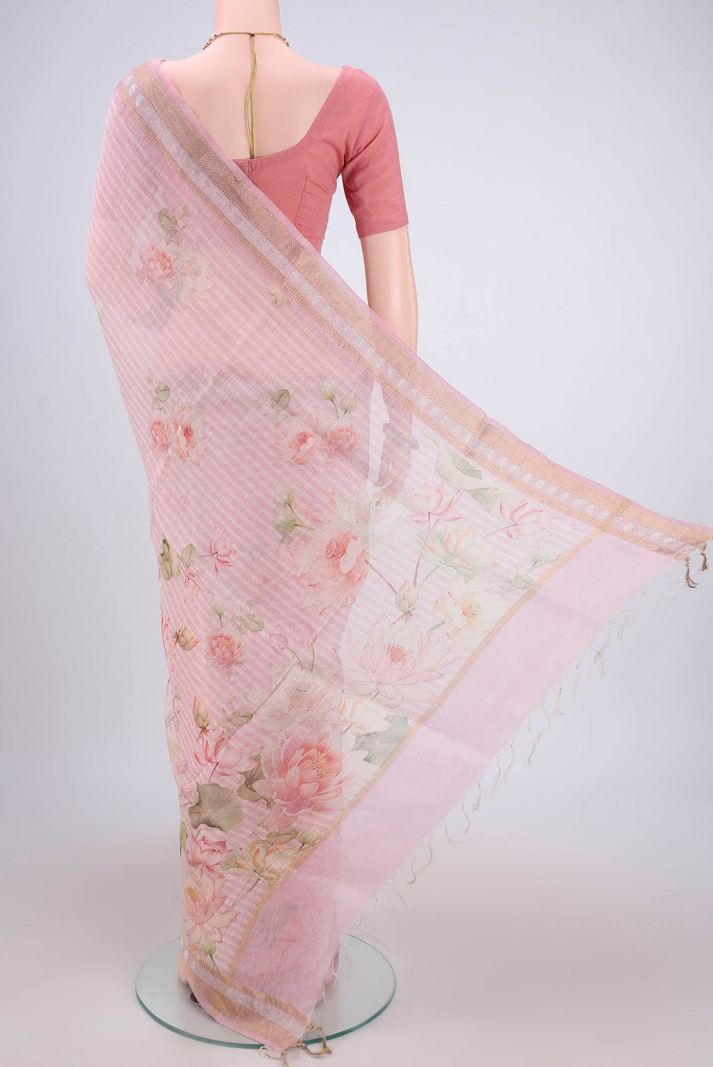 Flat view of Off White Linen Saree with Floral Print on the body and Zari Border. 