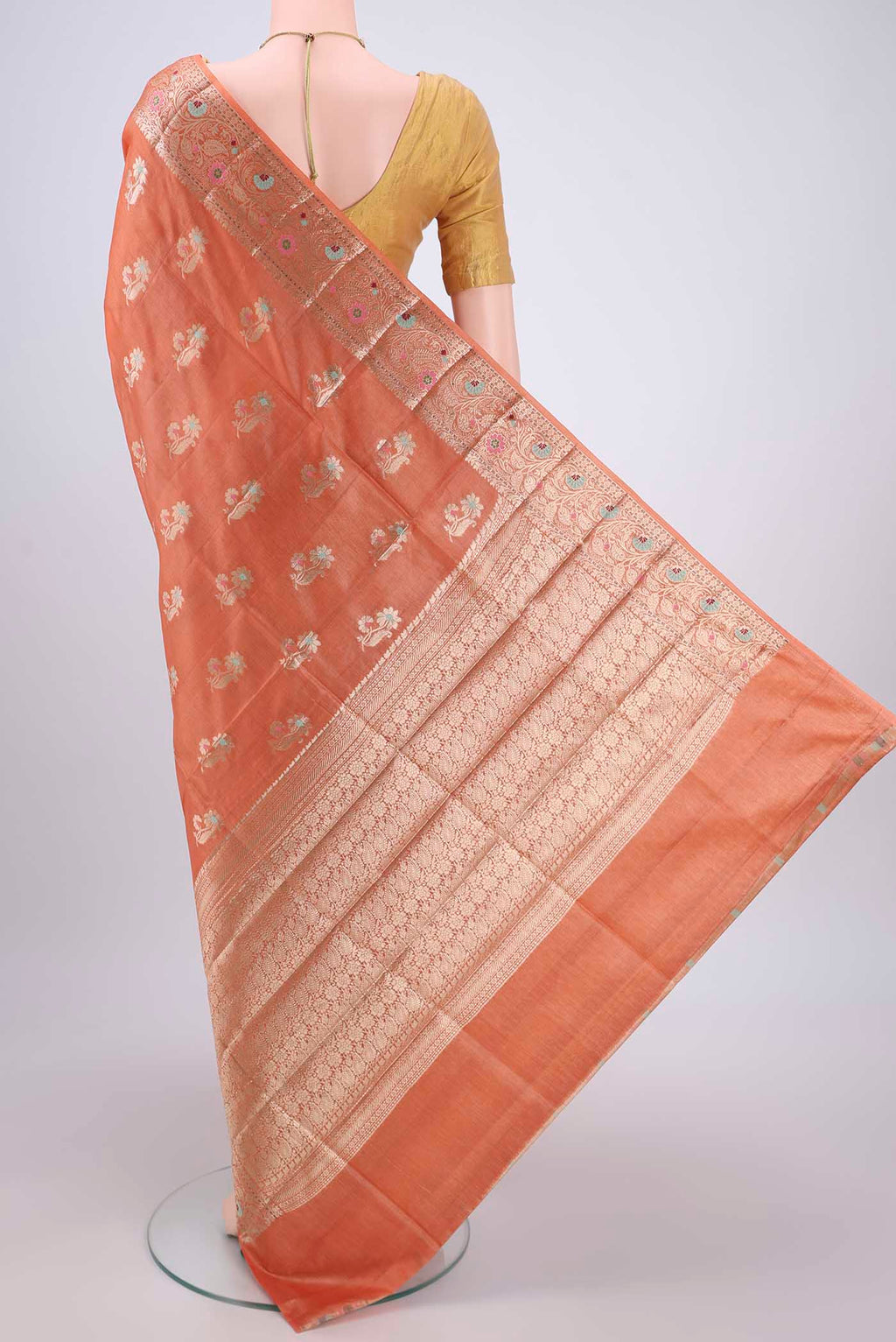 Flat view of Brick Orange Banarasi Tussar Silk Saree with Zari And Thread Butta on the body and Zari And Thread Border. 