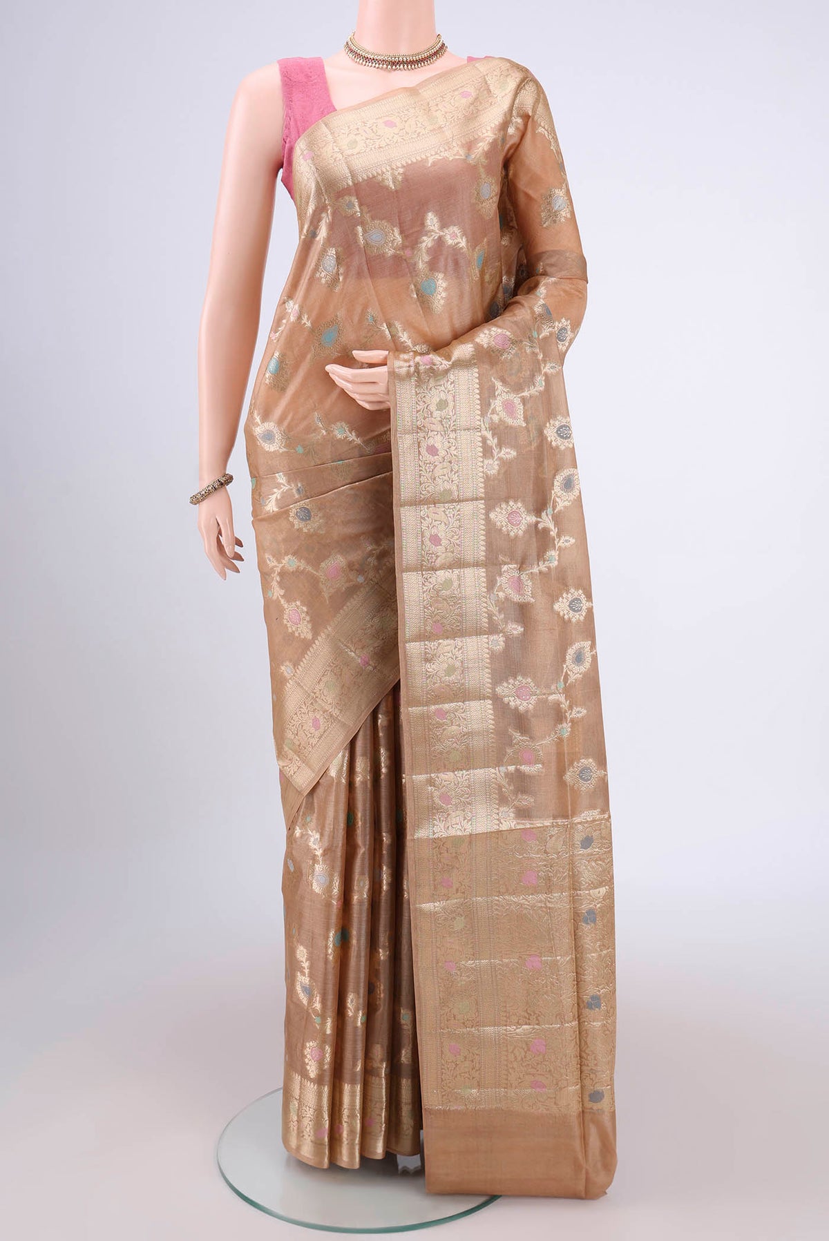 Beige Banarasi Tussar Silk Saree with Zari Brocade on the body and Zari And Thread Border.  displayed on a mannequin