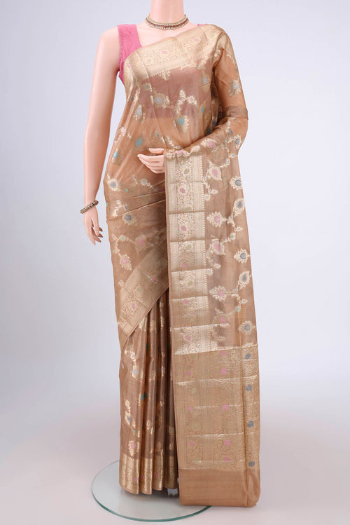 Beige Banarasi Tussar Silk Saree with Zari Brocade on the body and Zari And Thread Border.  displayed on a mannequin