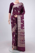 Burgundy Banarasi Raw Silk Saree with Zari And Thread Butta on the body and Zari And Thread Border.  displayed on a mannequin