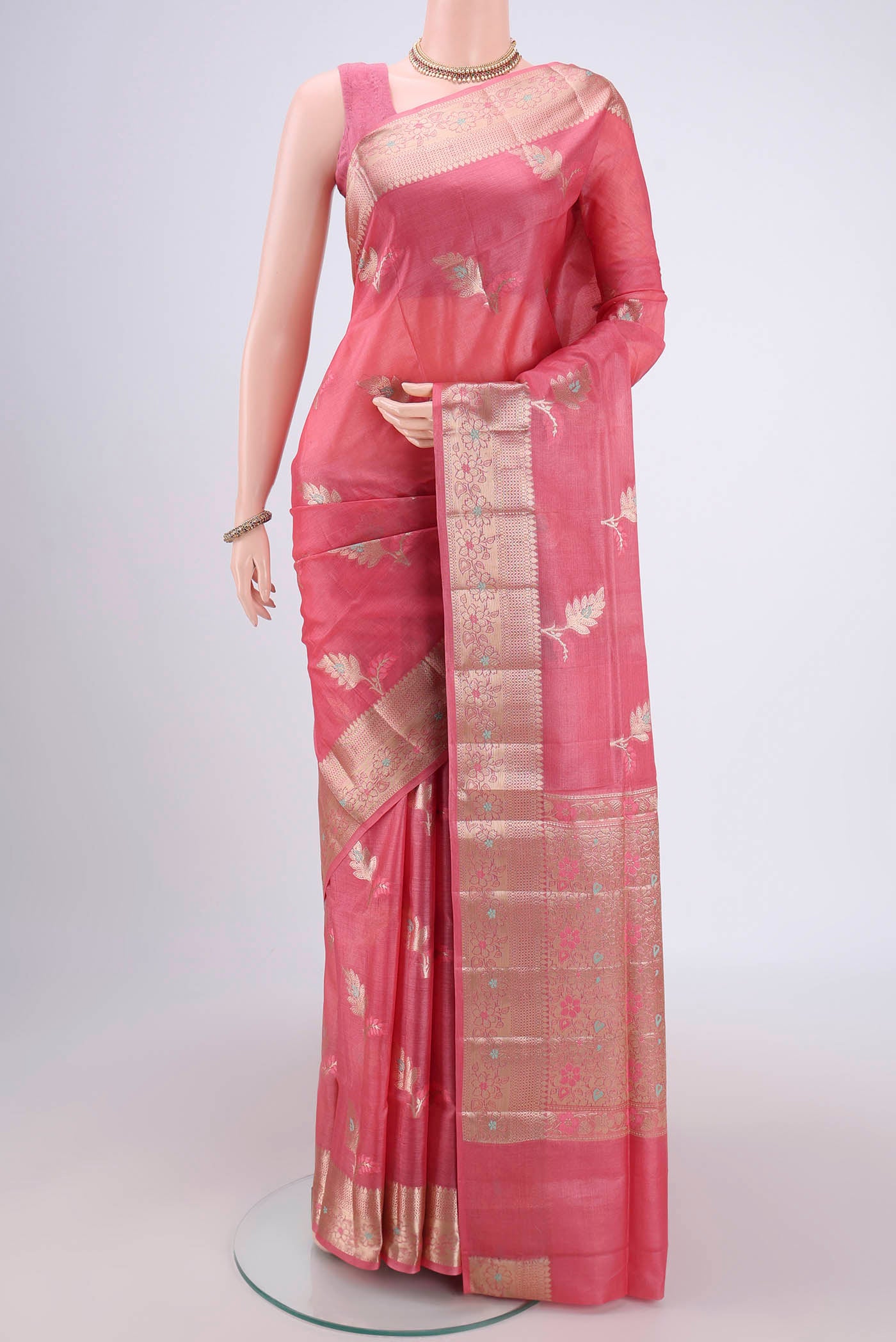 Pink Banarasi Raw Silk Saree with Zari And Thread Butta on the body and Zari And Thread Border.  displayed on a mannequin