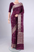Magenta Banarasi Tussar Silk Saree with Zari And Thread Butta on the body and Zari And Thread Border.  displayed on a mannequin