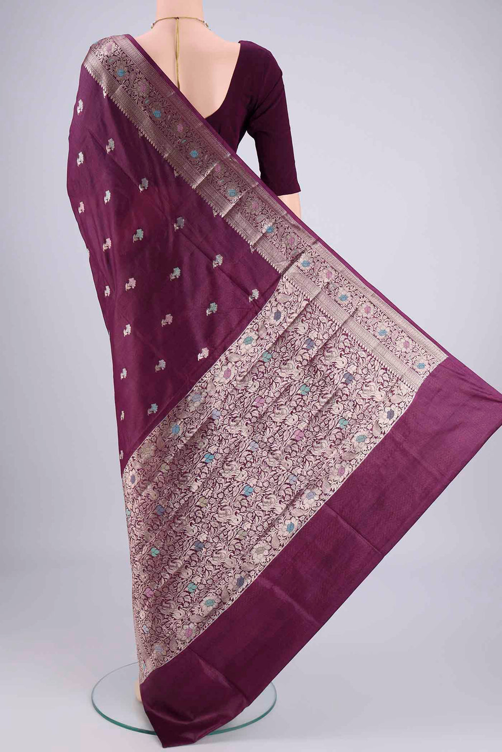 Flat view of Magenta Banarasi Tussar Silk Saree with Zari And Thread Butta on the body and Zari And Thread Border. 