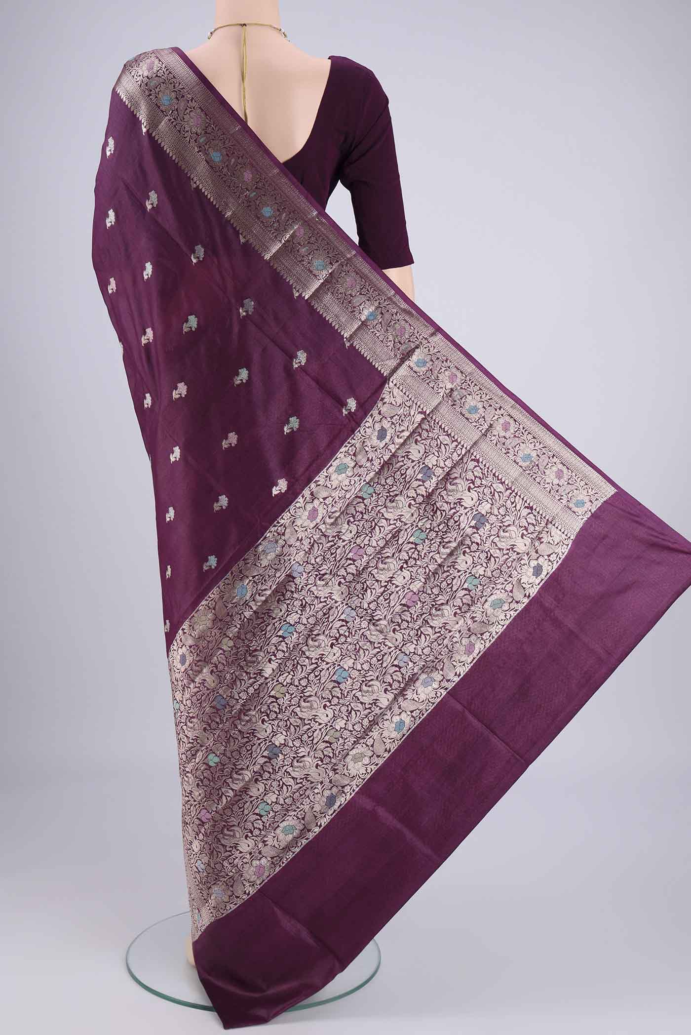 Flat view of Magenta Banarasi Tussar Silk Saree with Zari And Thread Butta on the body and Zari And Thread Border. 