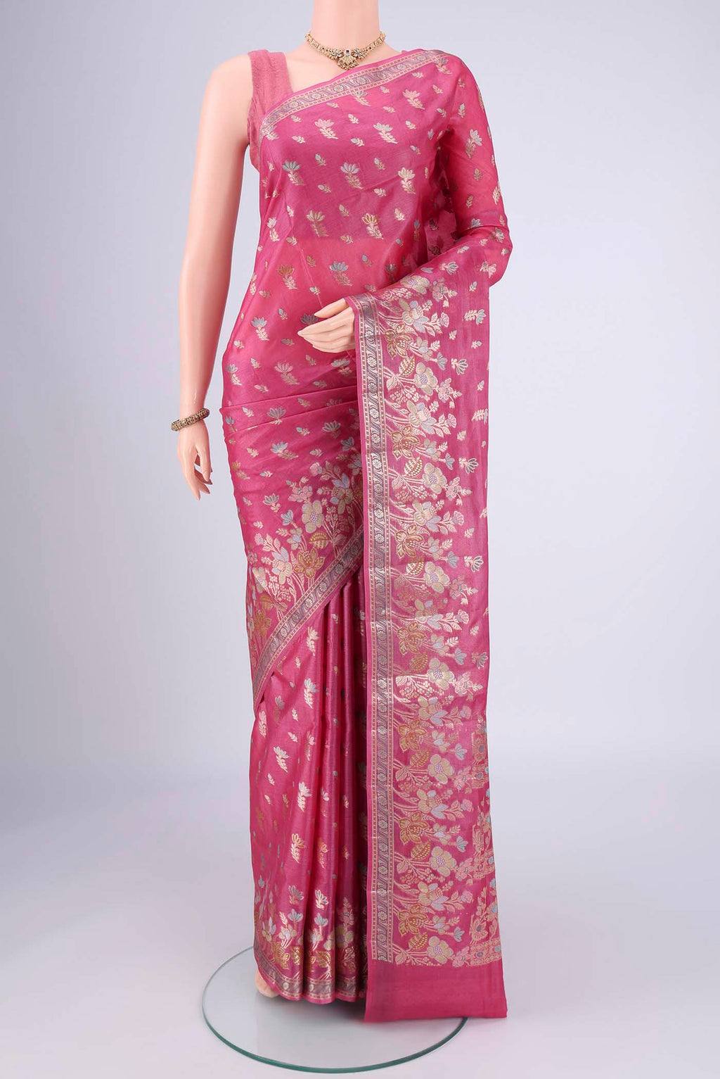 Pink Banarasi Tussar Silk Saree with Zari And Thread Butta on the body and Zari And Thread Border.  displayed on a mannequin
