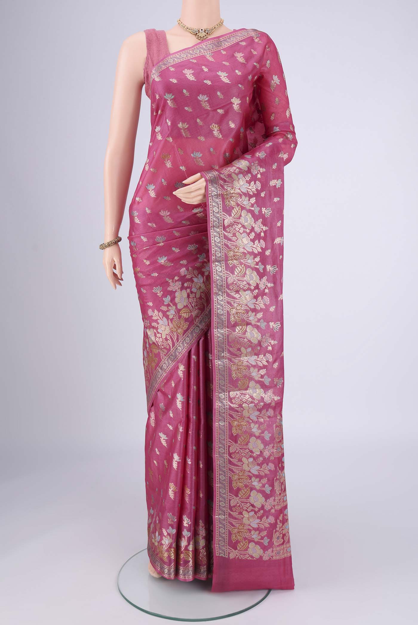 Pink Banarasi Tussar Silk Saree with Zari And Thread Butta on the body and Zari And Thread Border.  displayed on a mannequin