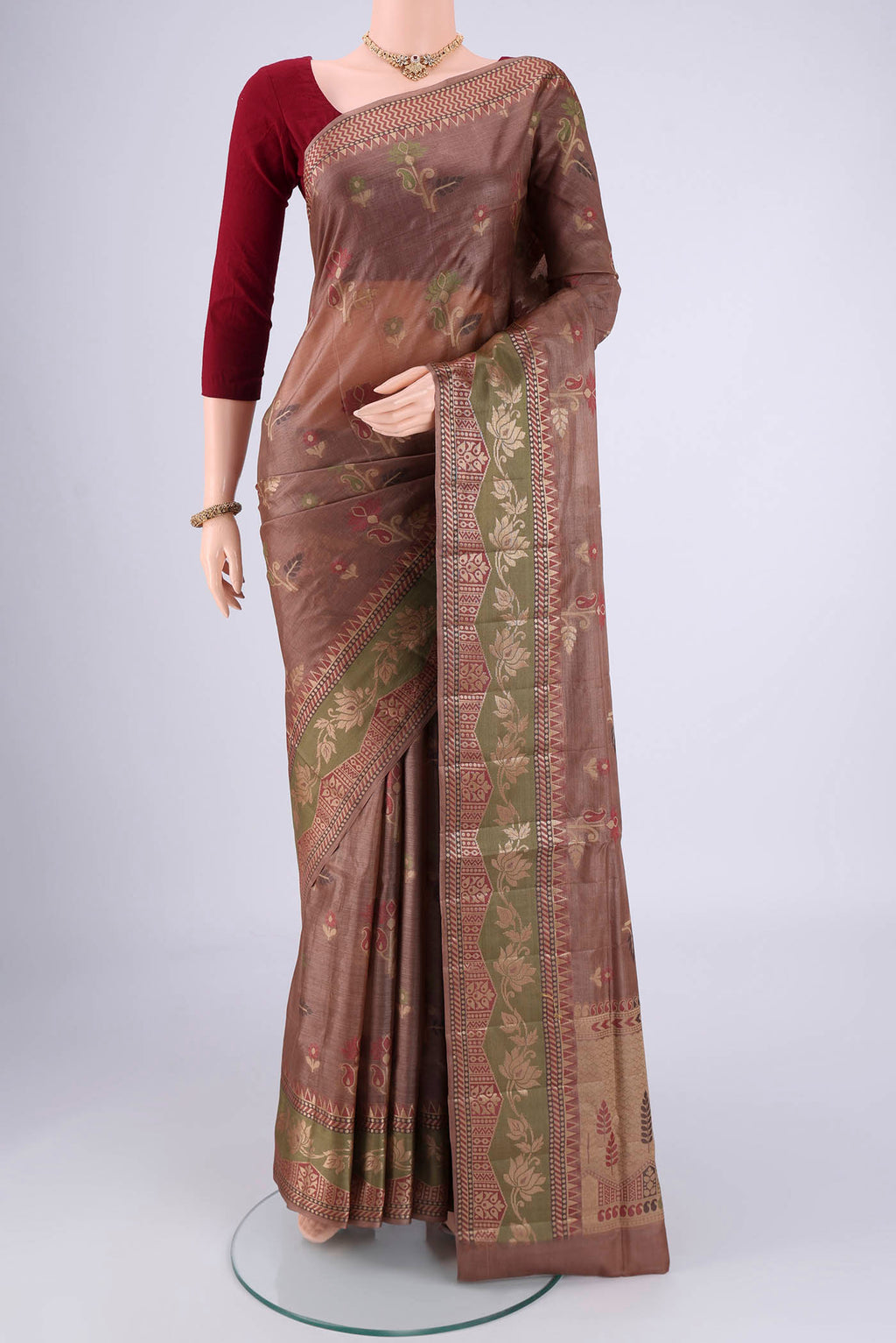 Brown Banarasi Tussar Silk Saree with Zari And Thread Butta on the body and Zari And Thread Border.  displayed on a mannequin