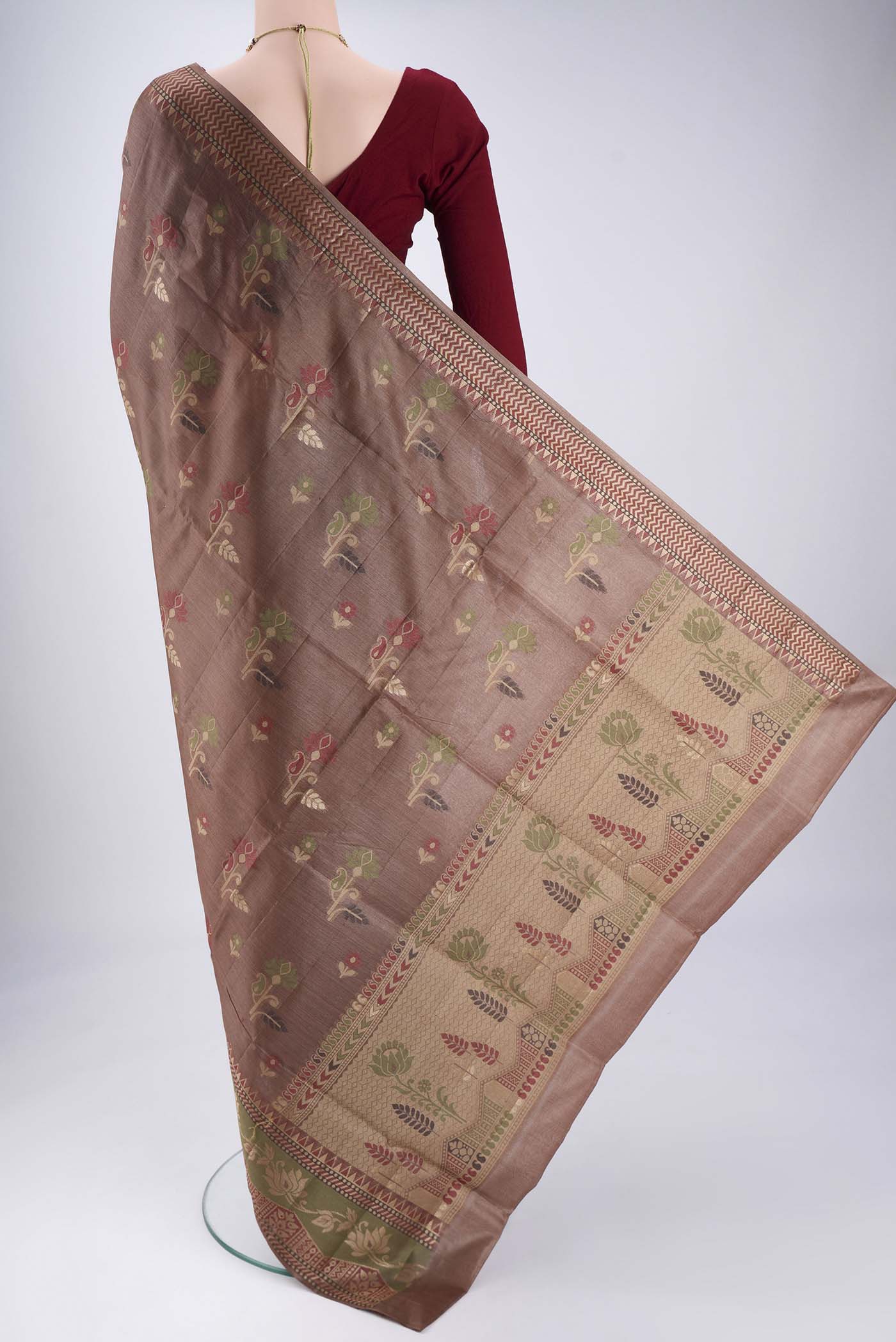 Flat view of Brown Banarasi Tussar Silk Saree with Zari And Thread Butta on the body and Zari And Thread Border. 