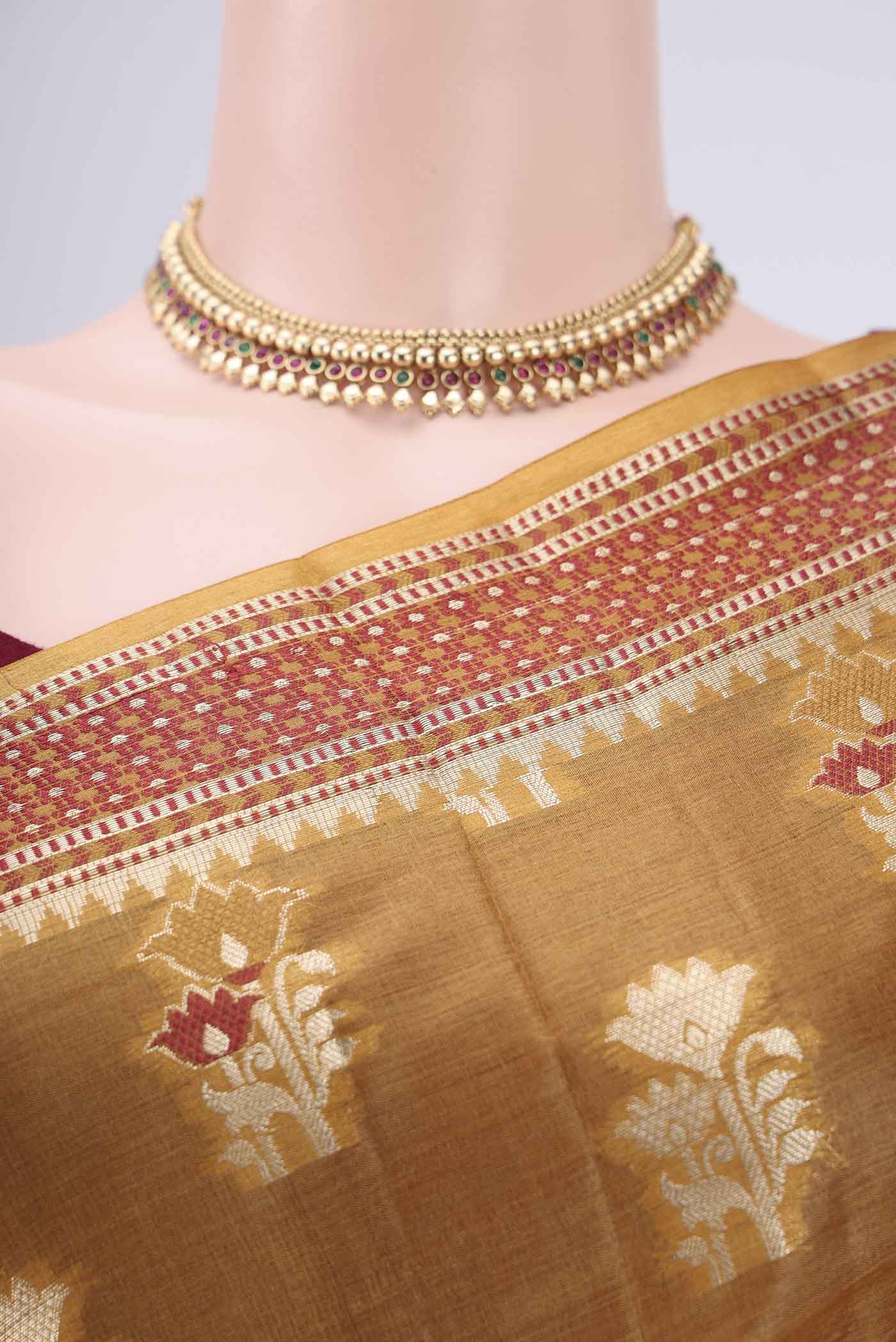 Border image of Mustard Banarasi Tussar Silk Saree with Zari Butta on the body and Zari And Thread Border. 