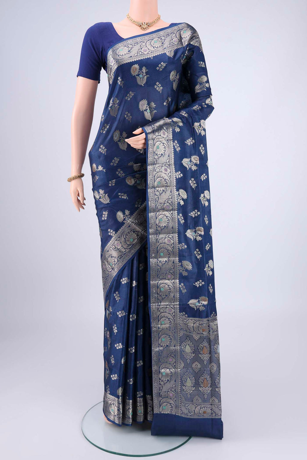 Blue Banarasi Tussar Silk Saree with Zari And Thread Butta on the body and Zari And Thread Border.  displayed on a mannequin