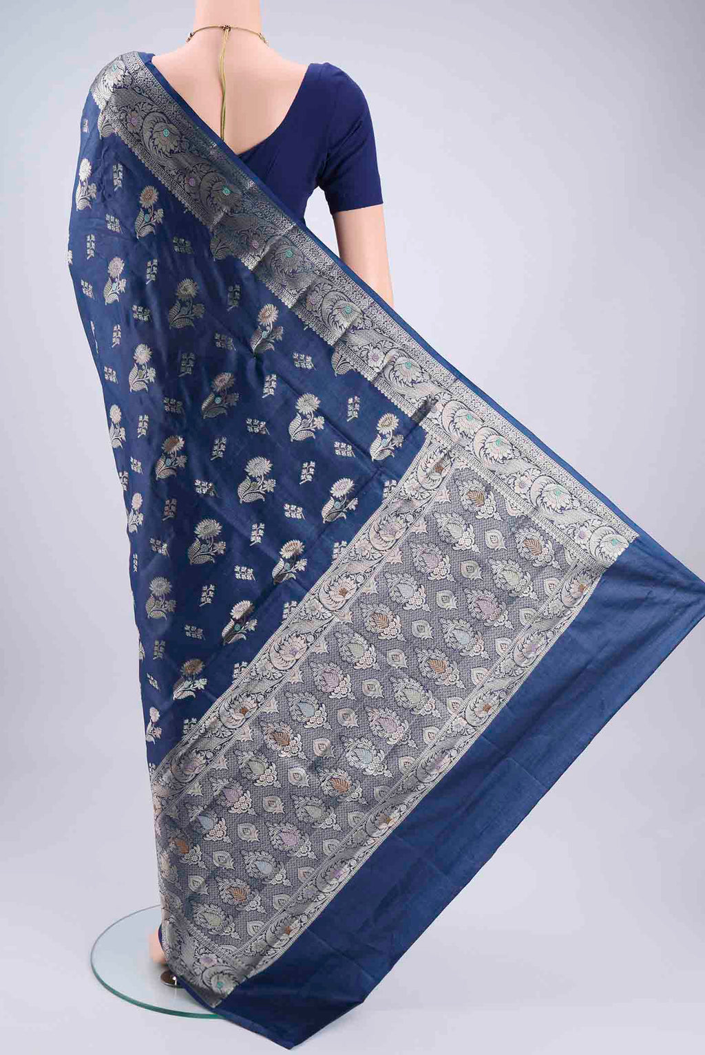 Flat view of Blue Banarasi Tussar Silk Saree with Zari And Thread Butta on the body and Zari And Thread Border. 