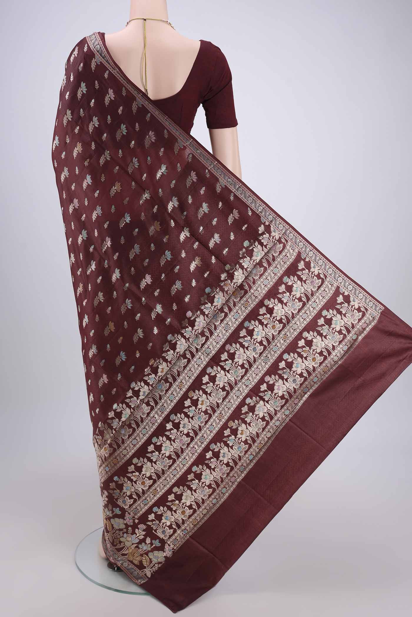 Flat view of Brown Banarasi Raw Silk Saree with Zari And Thread Butta on the body and Zari And Thread Border. 