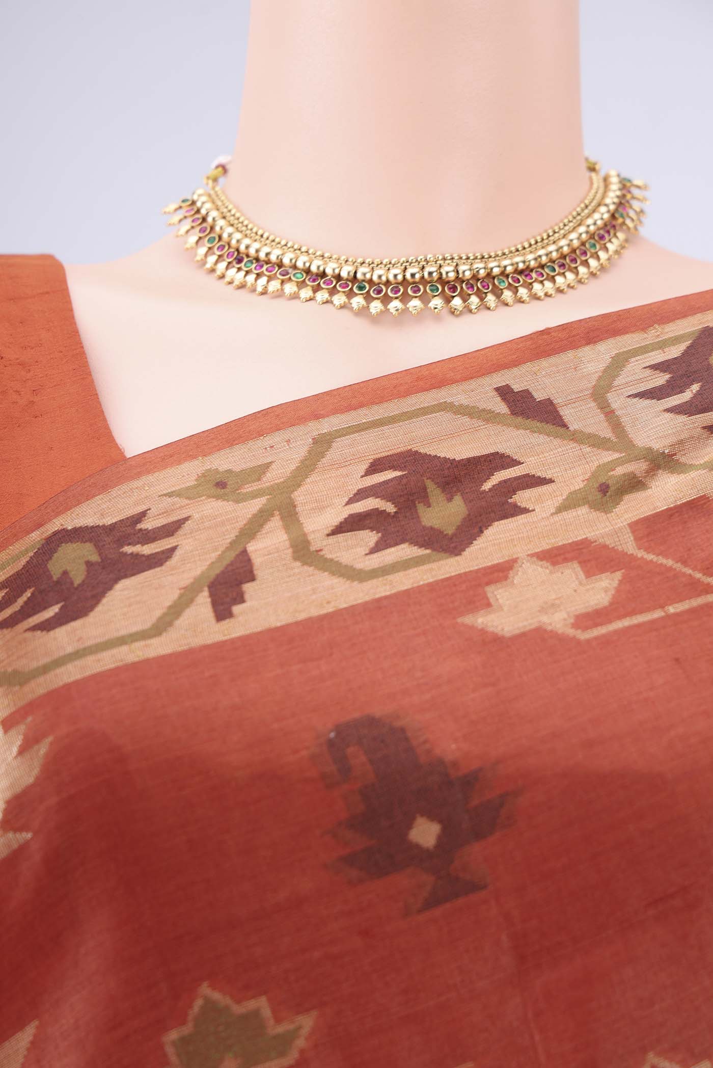 Border image of Rust Banarasi Tussar Silk Saree with Thread Brocade on the body and Temple Border. 