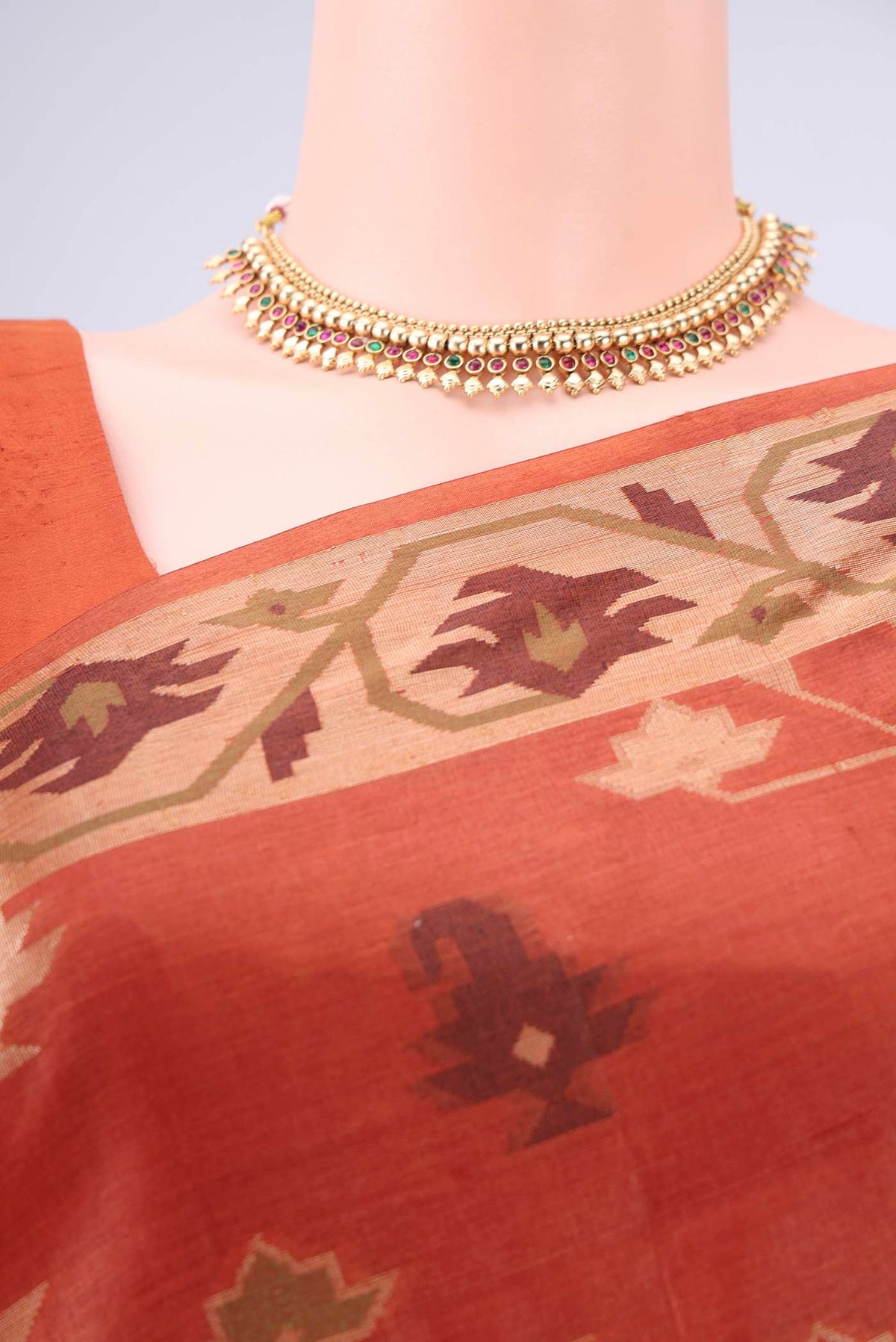 Border image of Rust Banarasi Tussar Silk Saree with Thread Brocade on the body and Temple Border. 
