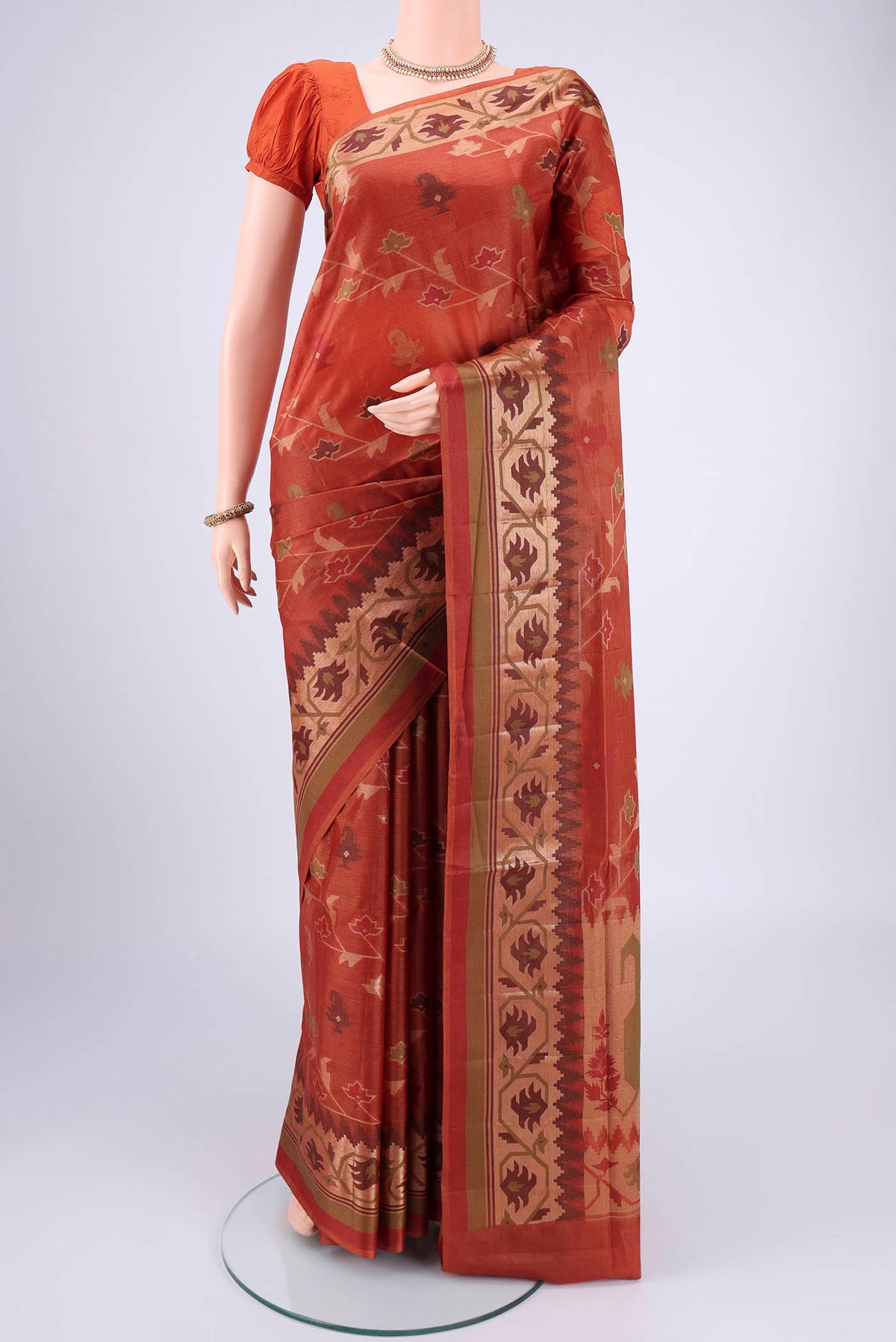Rust Banarasi Tussar Silk Saree with Thread Brocade on the body and Temple Border.  displayed on a mannequin